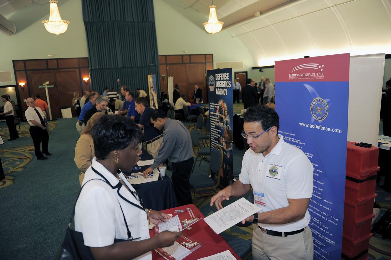 CAPE CANAVERAL, Fla. -- The Office of Personnel Management (OPM), NASA and Brevard Workforce host a job fair for former and current Kennedy Space Center aerospace workers at the Radisson Resort at the Port in Cape Canaveral, Fla.  More than 60 private industry employers and federal agencies are recruiting for local and worldwide positions, and more than 1,000 job seekers attended.  For more information, visit http://spacecoastjobfair.eventbrite.com. Photo credit: NASA/Kim Shiflett