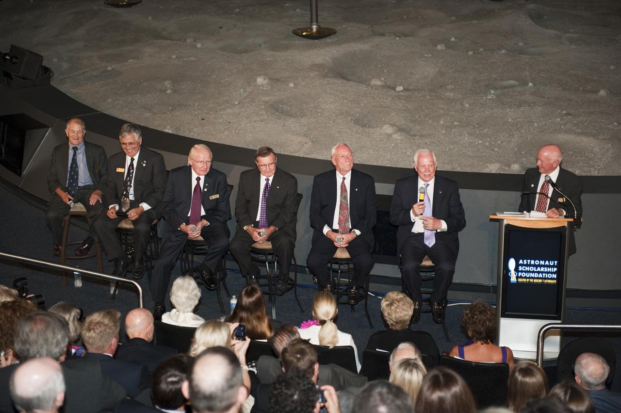 CAPE CANAVERAL, Fla. -- The Apollo/Saturn V Center at NASA's Kennedy Space Center in Florida hosted a celebration on the 40th anniversary of NASA's Apollo 15 mission. An elite gathering of Apollo-era astronauts were on hand for the event and panel discussion. Gerry Griffin, Apollo 15 flight director moderates the question-and-answer period with the panel. From left are: Apollo 15 astronaut backup support crew members, Joe Allen, Jack Schmitt, Vance Brand and Dick Gordon; Al Worden and Dave Scott.        Worden circled the moon while Scott and the late Jim Irwin, the Lunar Module commander, made history when they became the first humans to drive a vehicle on the surface of the moon. They also provided extensive descriptions and photographic documentation of geologic features in the vicinity of the Hadley Rille landing site during their three days on the lunar surface. Photo credit: NASA/Kim Shiflett