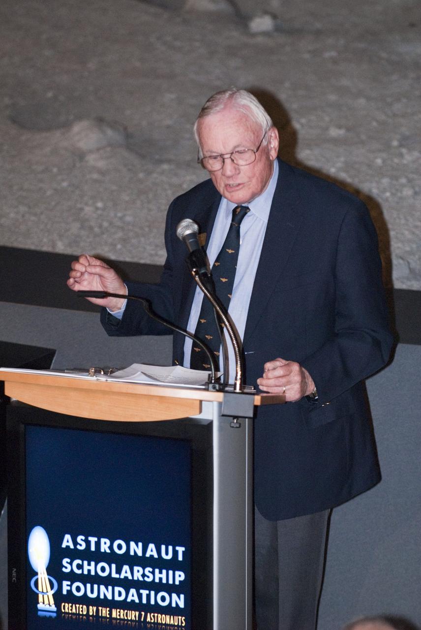CAPE CANAVERAL, Fla. -- The Apollo/Saturn V Center at NASA's Kennedy Space Center in Florida hosted a celebration on the 40th anniversary of NASA's Apollo 15 mission. Apollo 15 Commander Dave Scott, Command Module Pilot Al Worden and an elite gathering of Apollo-era astronauts were on hand for the event and panel discussion. Here, Apollo 11 Commander Neil Armstrong speaks to the invited guests. Worden circled the moon while Scott and the late Jim Irwin, the Lunar Module commander, made history when they became the first humans to drive a vehicle on the surface of the moon. They also provided extensive descriptions and photographic documentation of geologic features in the vicinity of the Hadley Rille landing site during their three days on the lunar surface. Photo credit: NASA/Kim Shiflett