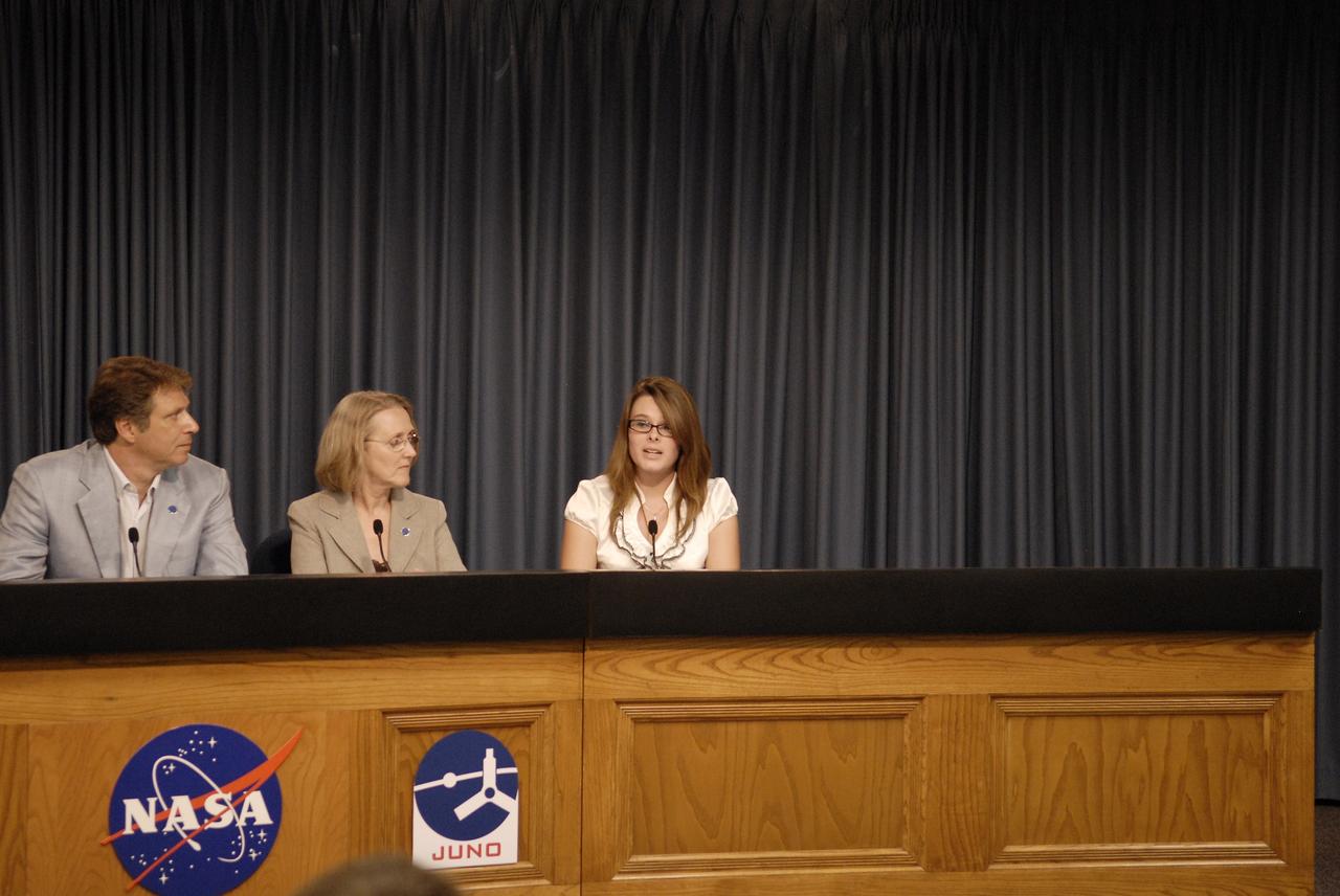 CAPE CANAVERAL, Fla. -- In the Press Site auditorium at NASA's Kennedy Space Center in Florida, a briefing was held to update media on the upcoming launch of NASA's Juno spacecraft. Seen here are Scott Bolton, Juno principal investigator with the Southwest Research Institute in San Antonio, Texas; Jan Chodas, Juno project manager with the Jet Propulsion Laboratory in Pasadena, Calif., and Kaelyn Badura, Pine Ridge High School, Deltona, Fla. high school student, Juno Education program participant and Goldstone Apple Valley Radio Telescope Project participant.                Juno is scheduled to launch aboard an United Launch Alliance Atlas V from Cape Canaveral, Fla. Aug. 5.The solar-powered spacecraft will orbit Jupiter's poles 33 times to find out more about the gas giant's origins, structure, atmosphere and magnetosphere and investigate the existence of a solid planetary core. For more information visit: www.nasa.gov/juno. Photo credit: NASA/Gianni M. Woods