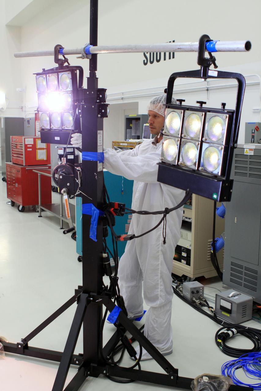 CAPE CANAVERAL, Fla. -- A Lockheed Martin technician in Astrotech Space Operation's payload processing facility in Titusville, Fla., tests the solar arrays on NASA's Gravity Recovery and Interior Laboratory-A, or GRAIL-A, spacecraft to ensure that they will function as planned during the mission.    The electrical power subsystem on each of GRAIL's twin spacecraft includes two solar arrays and a lithium ion battery. Each solar array is capable of producing no less than 700 watts. They will be deployed shortly after separation from the launch vehicle and remain fixed throughout the mission. GRAIL will fly in tandem orbits around the moon for several months to measure its gravity field. GRAIL's primary science objectives are to determine the structure of the lunar interior, from crust to core, and to advance understanding of the thermal evolution of the moon.  Launch aboard a United Launch Alliance Delta II rocket from Space Launch Complex 17B on Cape Canaveral Air Force Station is scheduled for Sept. 8.  For more information, visit http://www.nasa.gov/grail. Photo credit: NASA/Frankie Martin