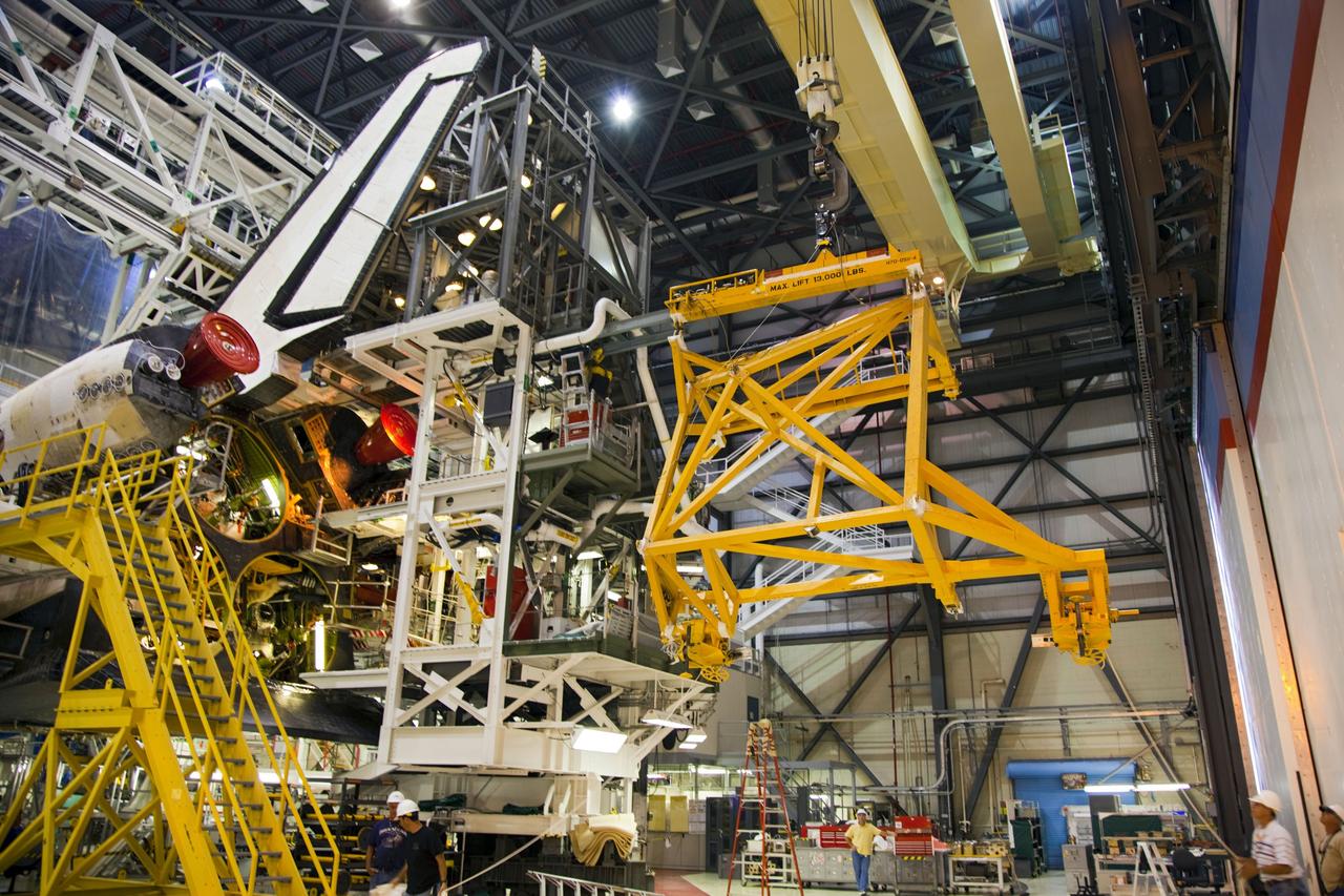 CAPE CANAVERAL, Fla. -- In Orbiter Processing Facility-1 at NASA’s Kennedy Space Center in Florida, an overhead crane is moved into place to begin the process of removing shuttle Endeavour’s orbital maneuvering system, or OMS, pods. The work is part of Endeavour’s transition and retirement processing. The spacecraft is being prepared for public display at the California Science Center in Los Angeles. Endeavour flew 25 missions, spent 299 days in space, orbited Earth 4,671 times and traveled 122, 883, 151 miles over the course of its 19-year career. Endeavour’s STS-134 and final mission was completed after landing on June 1, 2011. Photo credit: Frank Michaux
