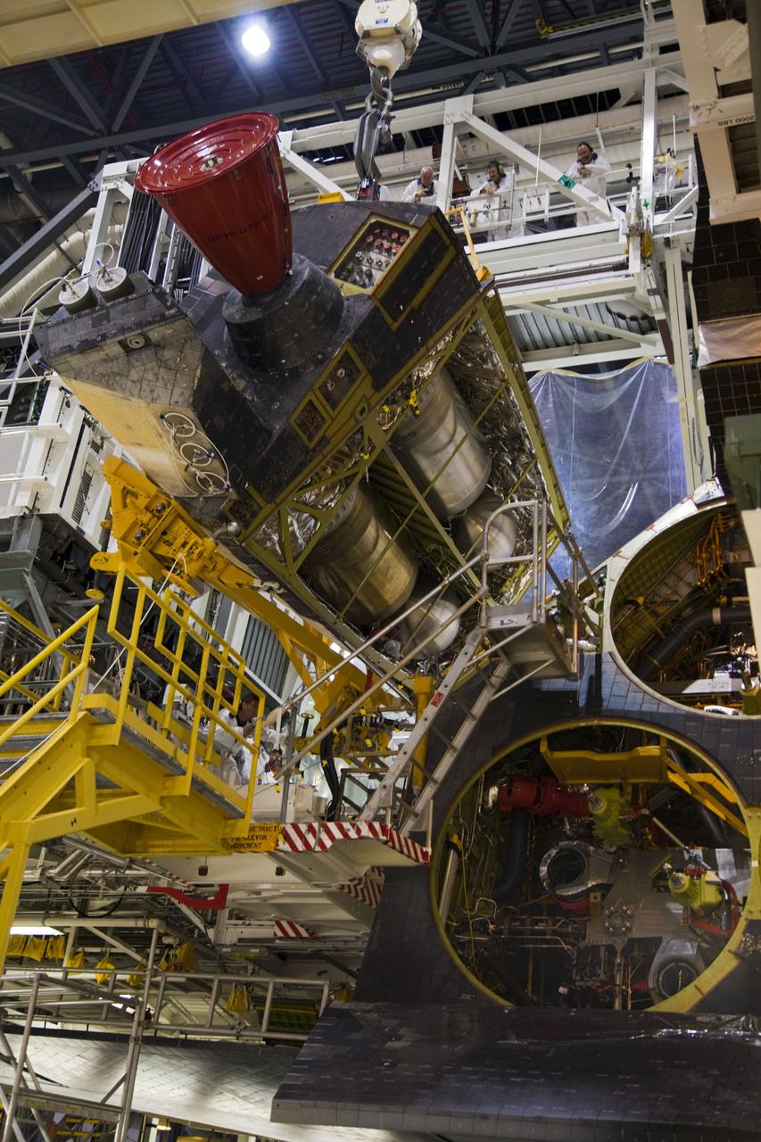 CAPE CANAVERAL, Fla. -- In Orbiter Processing Facility-1 at NASA’s Kennedy Space Center in Florida, an overhead crane is used to remove shuttle Endeavour’s left-hand orbital maneuvering system, or OMS, pod. The work is part of Endeavour’s transition and retirement processing. The spacecraft is being prepared for public display at the California Science Center in Los Angeles. Endeavour flew 25 missions, spent 299 days in space, orbited Earth 4,671 times and traveled 122, 883, 151 miles over the course of its 19-year career. Endeavour’s STS-134 and final mission was completed after landing on June 1, 2011. Photo credit: Frank Michaux