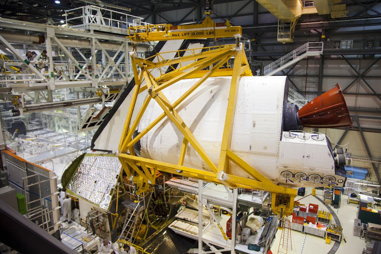 CAPE CANAVERAL, Fla. -- In Orbiter Processing Facility-1 at NASA’s Kennedy Space Center in Florida, an overhead crane moves shuttle Endeavour’s left-hand orbital maneuvering system, or OMS, pod away from the spacecraft. The work is part of Endeavour’s transition and retirement processing. The spacecraft is being prepared for public display at the California Science Center in Los Angeles. Endeavour flew 25 missions, spent 299 days in space, orbited Earth 4,671 times and traveled 122, 883, 151 miles over the course of its 19-year career. Endeavour’s STS-134 and final mission was completed after landing on June 1, 2011. Photo credit: Frank Michaux