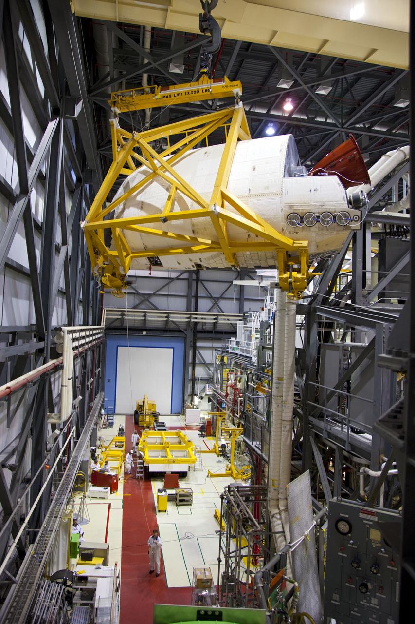 CAPE CANAVERAL, Fla. -- In Orbiter Processing Facility-1 at NASA’s Kennedy Space Center in Florida, an overhead crane moves shuttle Endeavour’s left-hand orbital maneuvering system, or OMS, pod toward a transporter. It will then be moved to the Hypergol Maintenance Facility. The work is part of Endeavour’s transition and retirement processing. The spacecraft is being prepared for public display at the California Science Center in Los Angeles. Endeavour flew 25 missions, spent 299 days in space, orbited Earth 4,671 times and traveled 122, 883, 151 miles over the course of its 19-year career. Endeavour’s STS-134 and final mission was completed after landing on June 1, 2011. Photo credit: Frank Michaux