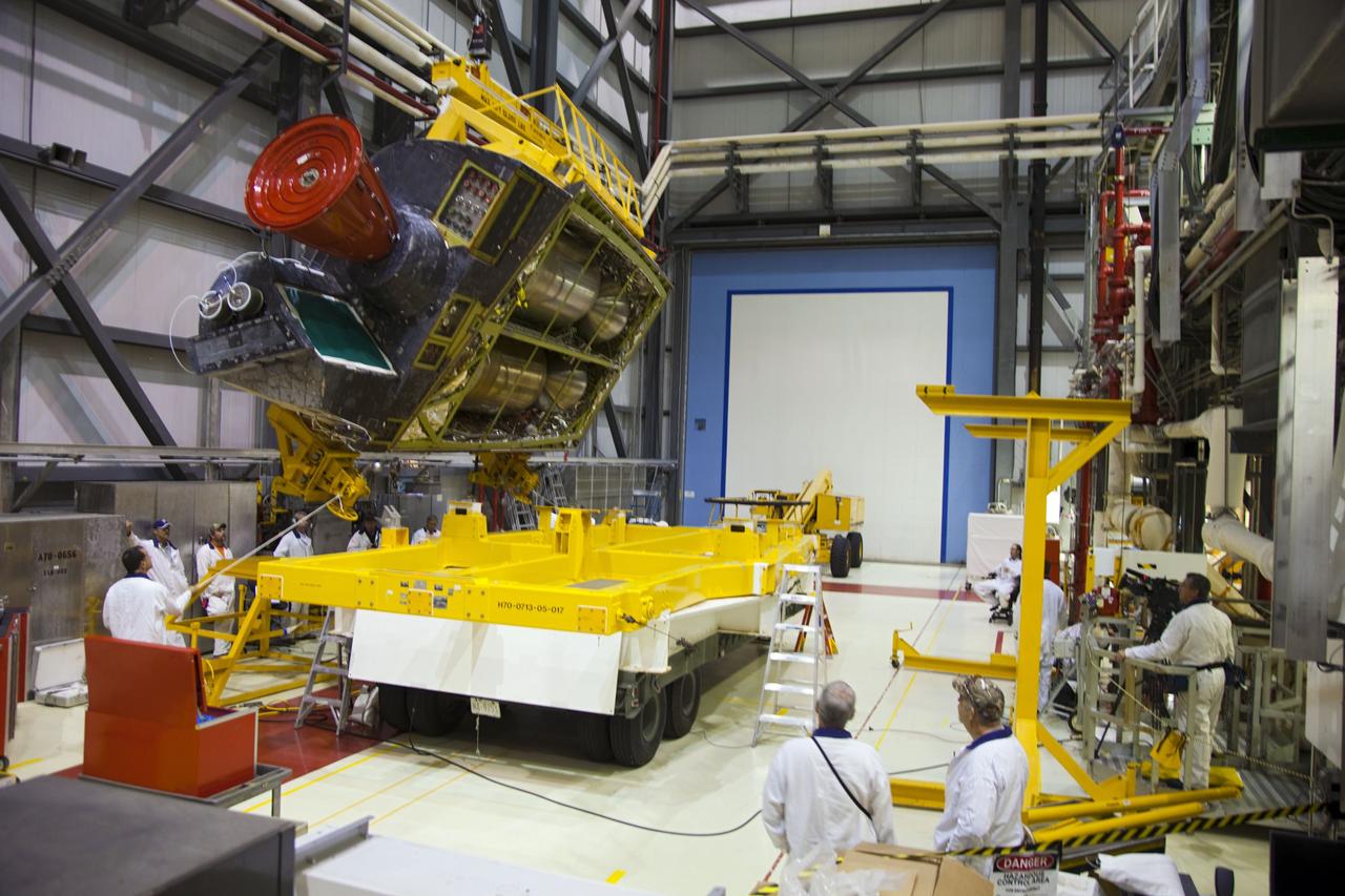 CAPE CANAVERAL, Fla. -- In Orbiter Processing Facility-1 at NASA’s Kennedy Space Center in Florida, technicians monitor the progress as an overhead crane lowers shuttle Endeavour’s left-hand orbital maneuvering system, or OMS, pod onto a transporter. It will then be moved to the Hypergol Maintenance Facility. The work is part of Endeavour’s transition and retirement processing. The spacecraft is being prepared for public display at the California Science Center in Los Angeles. Endeavour flew 25 missions, spent 299 days in space, orbited Earth 4,671 times and traveled 122, 883, 151 miles over the course of its 19-year career. Endeavour’s STS-134 and final mission was completed after landing on June 1, 2011. Photo credit: Frank Michaux