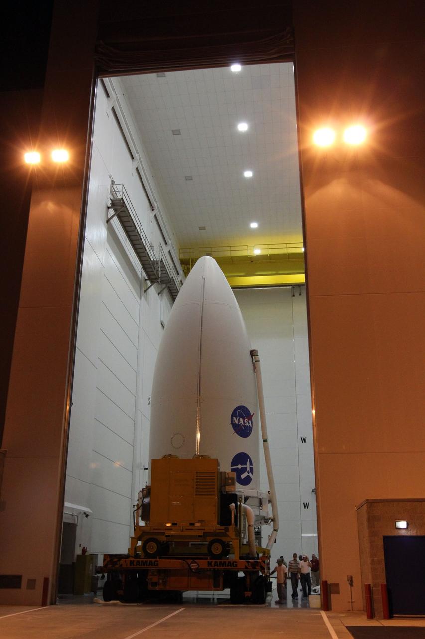 CAPE CANAVERAL, Fla. -- In the Astrotech Space Operations' payload processing facility in Titusville, Fla., preparations are under way to transport the Juno spacecraft, enclosed in an Atlas payload fairing, to Space Launch Complex 41.    The fairing will protect the spacecraft from the impact of aerodynamic pressure and heating during ascent and will be jettisoned once the spacecraft is outside the Earth's atmosphere. Juno is scheduled to launch Aug. 5 aboard a United Launch Alliance Atlas V rocket from Cape Canaveral Air Force Station in Florida. The solar-powered spacecraft will orbit Jupiter's poles 33 times to find out more about the gas giant's origins, structure, atmosphere and magnetosphere and investigate the existence of a solid planetary core. For more information, visit www.nasa.gov/juno. Photo credit: NASA/Cory Huston