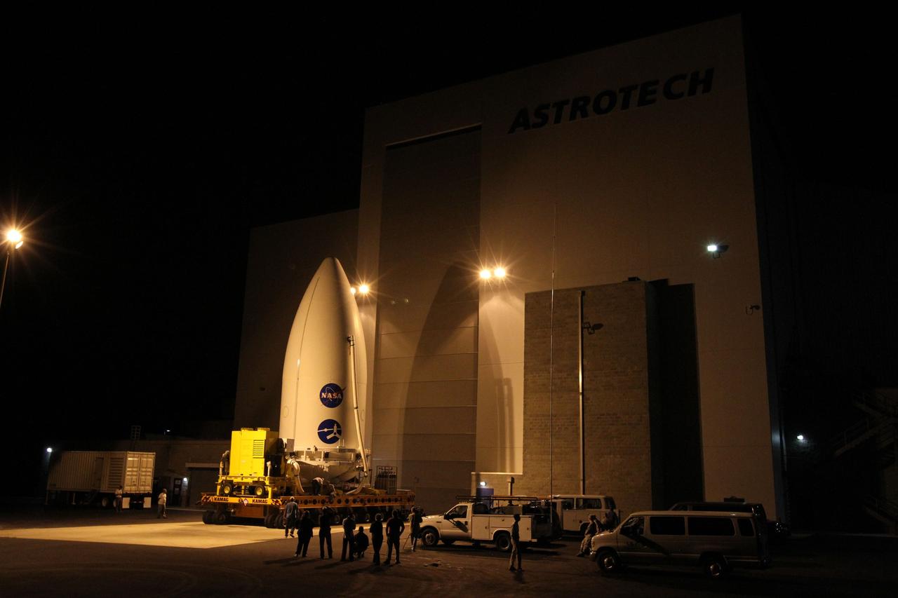CAPE CANAVERAL, Fla. -- The Juno spacecraft, enclosed in an Atlas payload fairing, begins its trip from the Astrotech Space Operations' payload processing facility in Titusville, Fla., to Space Launch Complex 41.    The fairing will protect the spacecraft from the impact of aerodynamic pressure and heating during ascent and will be jettisoned once the spacecraft is outside the Earth's atmosphere. Juno is scheduled to launch Aug. 5 aboard a United Launch Alliance Atlas V rocket from Cape Canaveral Air Force Station in Florida. The solar-powered spacecraft will orbit Jupiter's poles 33 times to find out more about the gas giant's origins, structure, atmosphere and magnetosphere and investigate the existence of a solid planetary core. For more information, visit www.nasa.gov/juno. Photo credit: NASA/Cory Huston