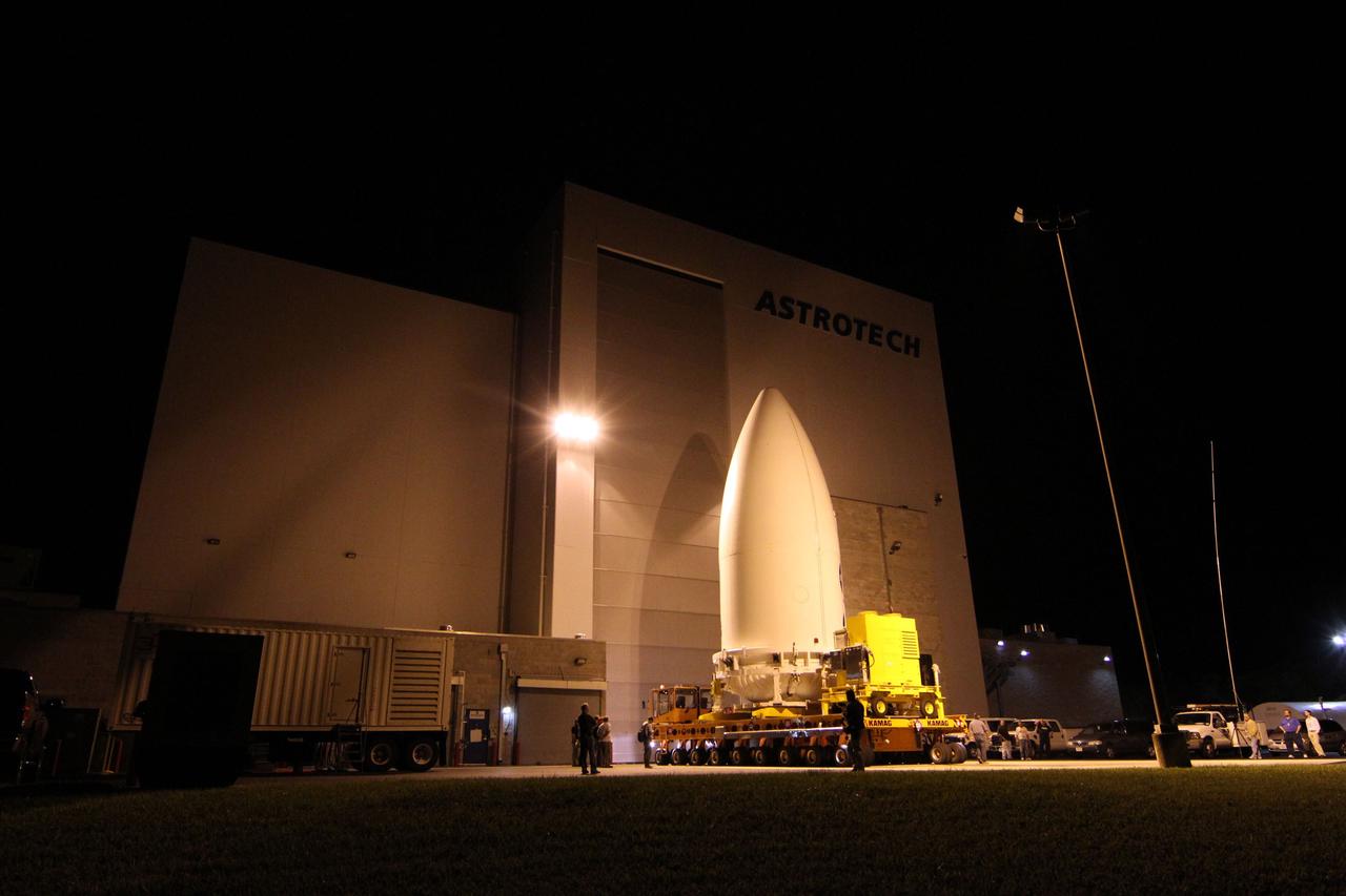 CAPE CANAVERAL, Fla. -- The Juno spacecraft, enclosed in an Atlas payload fairing, outside the Astrotech Space Operations' payload processing facility in Titusville, Fla., is ready for transport to Space Launch Complex 41.    The fairing will protect the spacecraft from the impact of aerodynamic pressure and heating during ascent and will be jettisoned once the spacecraft is outside the Earth's atmosphere. Juno is scheduled to launch Aug. 5 aboard a United Launch Alliance Atlas V rocket from Cape Canaveral Air Force Station in Florida. The solar-powered spacecraft will orbit Jupiter's poles 33 times to find out more about the gas giant's origins, structure, atmosphere and magnetosphere and investigate the existence of a solid planetary core. For more information, visit www.nasa.gov/juno. Photo credit: NASA/Cory Huston