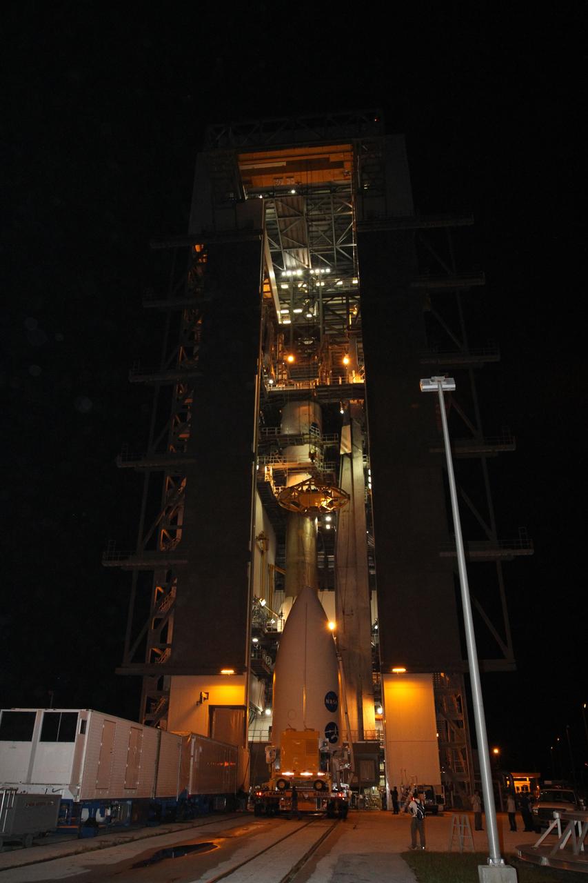 CAPE CANAVERAL, Fla. -- At Space Launch Complex 41, preparations are under way to lift the Juno spacecraft, enclosed in an Atlas payload fairing, on top of the Atlas rocket stacked in the Vertical Integration Facility. The spacecraft was prepared for launch in the Astrotech Space Operations' payload processing facility in Titusville, Fla.    The fairing will protect the spacecraft from the impact of aerodynamic pressure and heating during ascent and will be jettisoned once the spacecraft is outside the Earth's atmosphere. Juno is scheduled to launch Aug. 5 aboard a United Launch Alliance Atlas V rocket from Cape Canaveral Air Force Station in Florida. The solar-powered spacecraft will orbit Jupiter's poles 33 times to find out more about the gas giant's origins, structure, atmosphere and magnetosphere and investigate the existence of a solid planetary core. For more information, visit www.nasa.gov/juno. Photo credit: NASA/Cory Huston