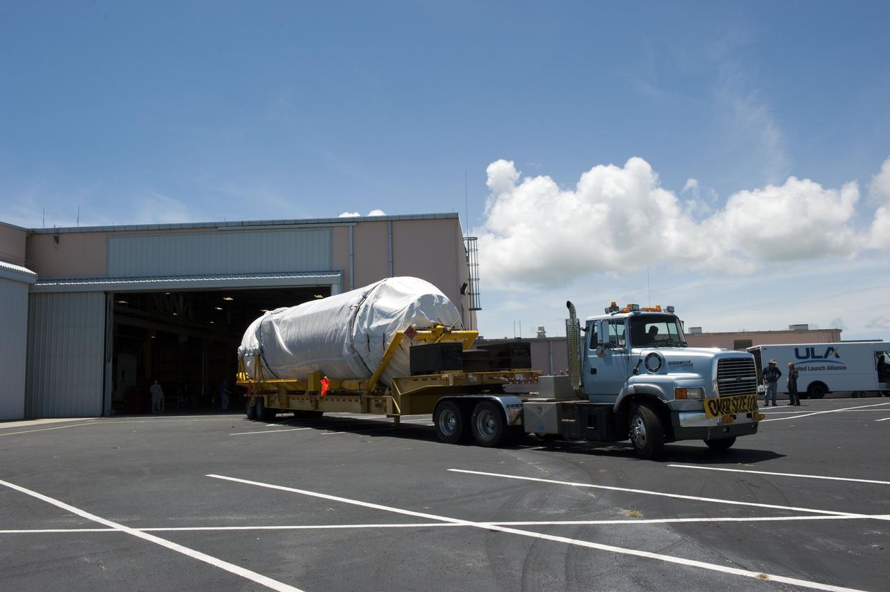 CAPE CANAVERAL, Fla. -- The Centaur upper stage to support the Mars Science Laboratory (MSL) mission arrives at the Atlas Spaceflight Operations Center on Cape Canaveral Air Force Station in Florida.    MSL's components include a compact car-sized rover, Curiosity, which has 10 science instruments designed to search for evidence on whether Mars has had environments favorable to microbial life, including chemical ingredients for life.  The unique rover will use a laser to look inside rocks and release its gasses so that the rover’s spectrometer can analyze and send the data back to Earth. Launch of MSL aboard a United Launch Alliance Atlas V rocket is scheduled for Nov. 25 from Space Launch Complex 41 on Cape Canaveral Air Force Station. For more information, visit http://www.nasa.gov/msl. Photo credit: NASA/Kim Shiflett