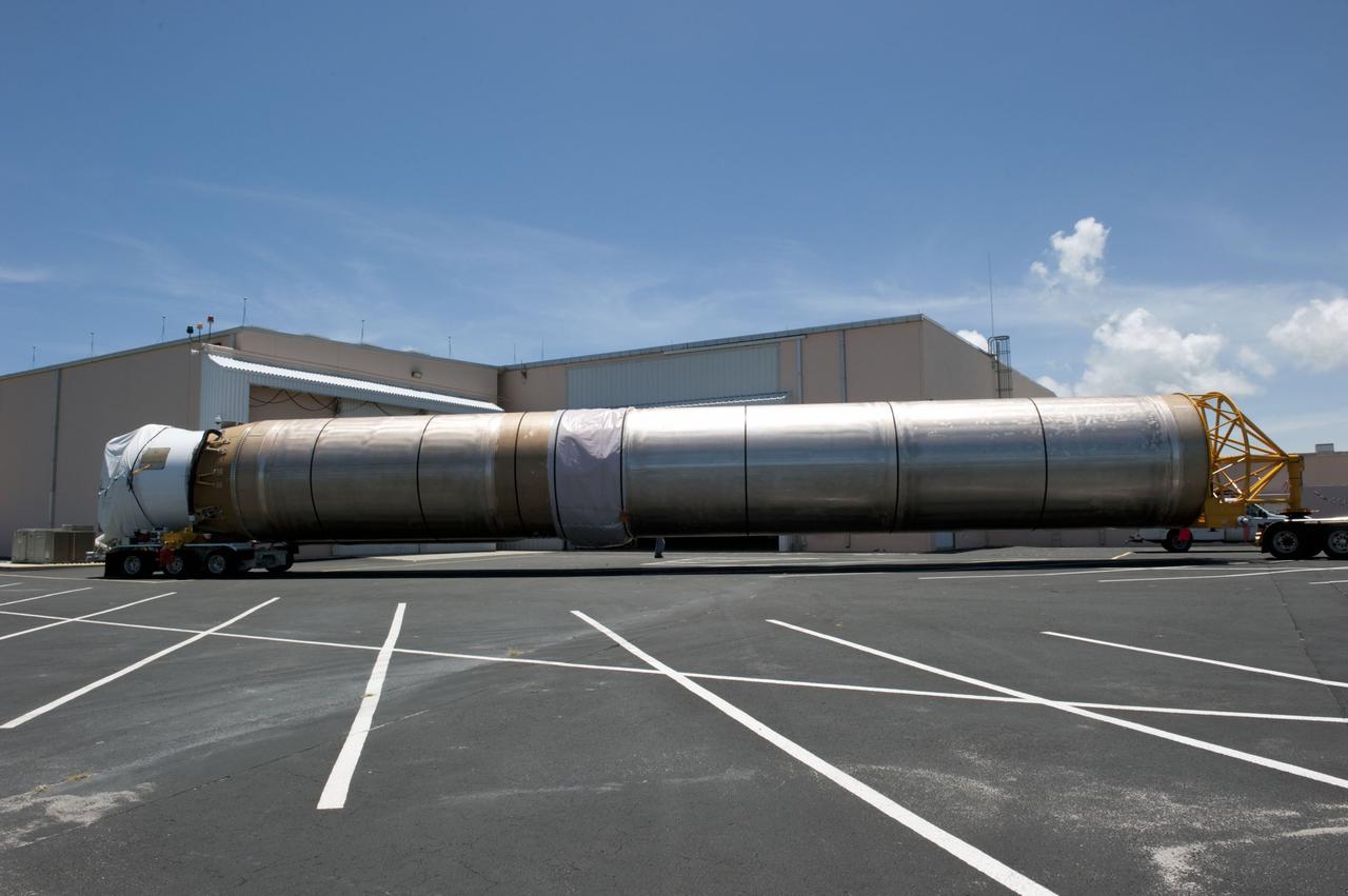 CAPE CANAVERAL, Fla. -- The Atlas V first stage to support the Mars Science Laboratory (MSL) mission arrives at the Atlas Spaceflight Operations Center on Cape Canaveral Air Force Station in Florida.    MSL's components include a compact car-sized rover, Curiosity, which has 10 science instruments designed to search for evidence on whether Mars has had environments favorable to microbial life, including chemical ingredients for life.  The unique rover will use a laser to look inside rocks and release its gasses so that the rover’s spectrometer can analyze and send the data back to Earth. Launch of MSL aboard a United Launch Alliance Atlas V rocket is scheduled for Nov. 25 from Space Launch Complex 41 on Cape Canaveral Air Force Station. For more information, visit http://www.nasa.gov/msl. Photo credit: NASA/Kim Shiflett
