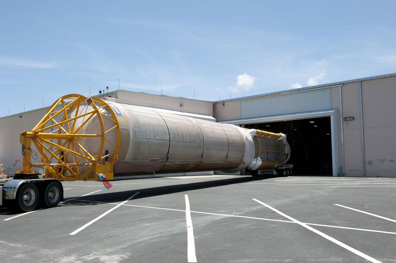 CAPE CANAVERAL, Fla. -- The door of the Atlas Spaceflight Operations Center on Cape Canaveral Air Force Station in Florida is opened to receive the Atlas V first stage to support the Mars Science Laboratory (MSL) mission.    MSL's components include a compact car-sized rover, Curiosity, which has 10 science instruments designed to search for evidence on whether Mars has had environments favorable to microbial life, including chemical ingredients for life.  The unique rover will use a laser to look inside rocks and release its gasses so that the rover’s spectrometer can analyze and send the data back to Earth. Launch of MSL aboard a United Launch Alliance Atlas V rocket is scheduled for Nov. 25 from Space Launch Complex 41 on Cape Canaveral Air Force Station. For more information, visit http://www.nasa.gov/msl. Photo credit: NASA/Kim Shiflett