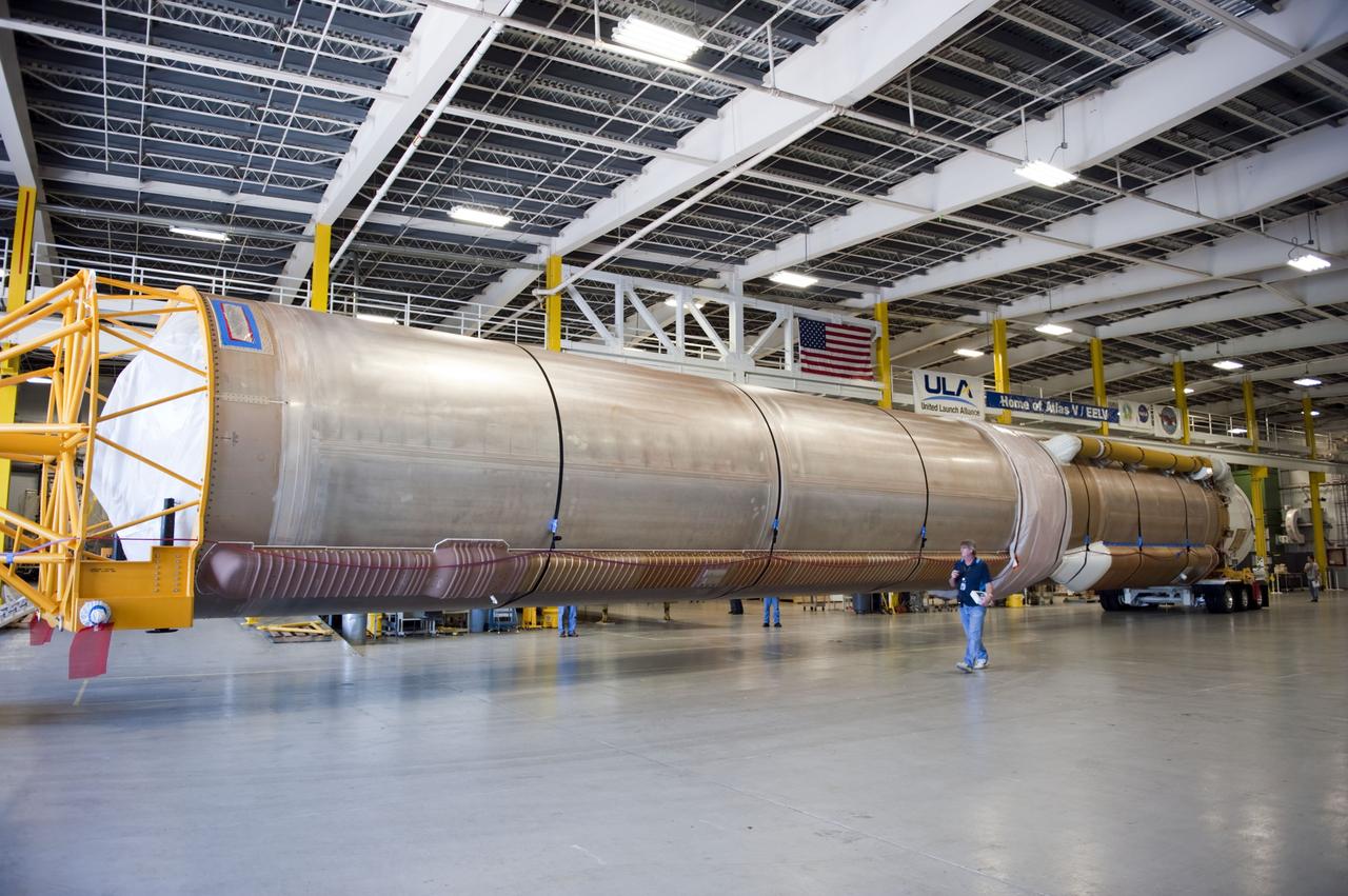 CAPE CANAVERAL, Fla. -- The Atlas V first stage to support the Mars Science Laboratory (MSL) mission is positioned inside the Atlas Spaceflight Operations Center on Cape Canaveral Air Force Station in Florida.    MSL's components include a compact car-sized rover, Curiosity, which has 10 science instruments designed to search for evidence on whether Mars has had environments favorable to microbial life, including chemical ingredients for life.  The unique rover will use a laser to look inside rocks and release its gasses so that the rover’s spectrometer can analyze and send the data back to Earth. Launch of MSL aboard a United Launch Alliance Atlas V rocket is scheduled for Nov. 25 from Space Launch Complex 41 on Cape Canaveral Air Force Station. For more information, visit http://www.nasa.gov/msl. Photo credit: NASA/Kim Shiflett