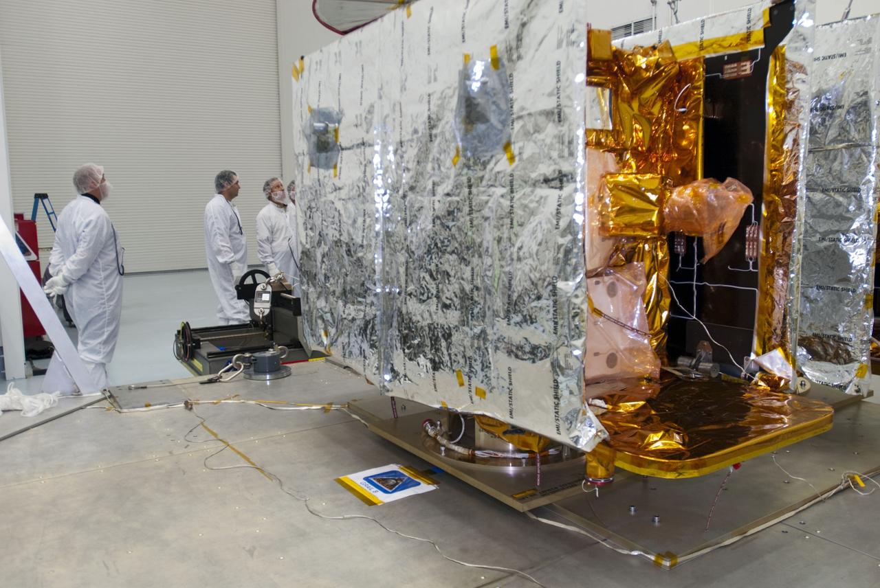 CAPE CANAVERAL, Fla. -- Lockheed Martin technicians examine NASA's twin Gravity Recovery and Interior Laboratory lunar spacecraft before they are moved onto workstands in the Hazardous Processing Facility (HPF) at Astrotech Space Operation's payload processing facility in Titusville, Fla. In the HPF, the spacecraft will undergo two days of fueling activities. GRAIL will fly in tandem orbits around the moon for several months to measure its gravity field. GRAIL's primary science objectives are to determine the structure of the lunar interior, from crust to core, and to advance understanding of the thermal evolution of the moon. Launch aboard a United Launch Alliance Delta II rocket from Space Launch Complex 17B on Cape Canaveral Air Force Station is scheduled for Sept. 8. For more information, visit http://www.nasa.gov/grail. Photo credit: NASA/Charisse Nahser