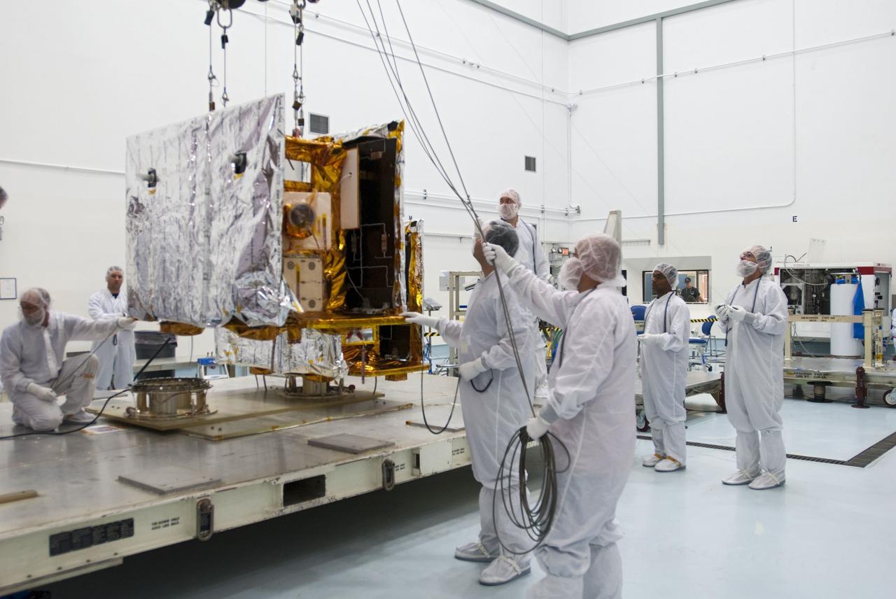 CAPE CANAVERAL, Fla. -- One of NASA's twin Gravity Recovery and Interior Laboratory lunar spacecraft is lifted from its transporter for placement on a workstand in the Hazardous Processing Facility (HPF) at Astrotech Space Operation's payload processing facility in Titusville, Fla.  In the HPF, the spacecraft will undergo two days of fueling activities.    GRAIL will fly in tandem orbits around the moon for several months to measure its gravity field. GRAIL's primary science objectives are to determine the structure of the lunar interior, from crust to core, and to advance understanding of the thermal evolution of the moon.  Launch aboard a United Launch Alliance Delta II rocket from Space Launch Complex 17B on Cape Canaveral Air Force Station is scheduled for Sept. 8.  For more information, visit http://www.nasa.gov/grail. Photo credit: NASA/Charisse Nahser