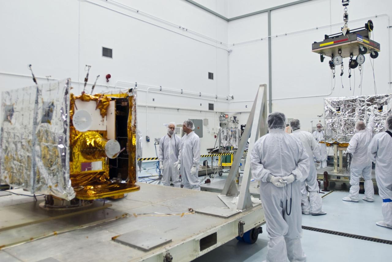 CAPE CANAVERAL, Fla. -- Lockheed Martin technicians prepare to move the second of NASA's twin Gravity Recovery and Interior Laboratory lunar spacecraft to a workstand in the Hazardous Processing Facility (HPF) at Astrotech Space Operation's payload processing facility in Titusville, Fla.  In the HPF, the spacecraft will undergo two days of fueling activities.    GRAIL will fly in tandem orbits around the moon for several months to measure its gravity field. GRAIL's primary science objectives are to determine the structure of the lunar interior, from crust to core, and to advance understanding of the thermal evolution of the moon.  Launch aboard a United Launch Alliance Delta II rocket from Space Launch Complex 17B on Cape Canaveral Air Force Station is scheduled for Sept. 8.  For more information, visit http://www.nasa.gov/grail. Photo credit: NASA/Charisse Nahser