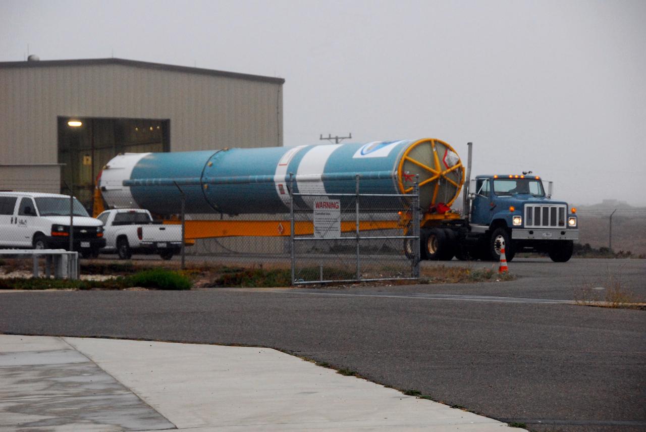 VANDENBERG AIR FORCE BASE, Calif. -- The first stage of a United Launch Alliance Delta II that will carry NASA's National Polar-orbiting Operational Environmental Satellite System Preparatory Project (NPP) satellite into space is on its way from NASA Hangar 836 to NASA's Space Launch Complex-2 at Vandenberg Air Force Base in California.    NPP will be positioned 512 miles above the Earth's surface and will orbit about 16 times each day to observe nearly the entire globe. The NPP mission for NASA and the National Oceanic and Atmospheric Administration (NOAA) is to measure Earth's atmospheric and sea surface temperatures, humidity sounding, land and ocean biological activity, and cloud and aerosol properties. For more information, visit www.nasa.gov/NPP. Photo credit: NASA/VAFB, Mark Mackley