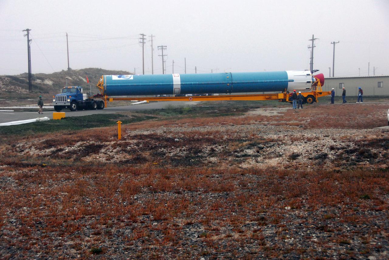 VANDENBERG AIR FORCE BASE, Calif. -- The first stage of a United Launch Alliance Delta II that will carry NASA's National Polar-orbiting Operational Environmental Satellite System Preparatory Project (NPP) satellite into space is on its way from NASA Hangar 836 to NASA's Space Launch Complex-2 at Vandenberg Air Force Base in California.    NPP will be positioned 512 miles above the Earth's surface and will orbit about 16 times each day to observe nearly the entire globe. The NPP mission for NASA and the National Oceanic and Atmospheric Administration (NOAA) is to measure Earth's atmospheric and sea surface temperatures, humidity sounding, land and ocean biological activity, and cloud and aerosol properties. For more information, visit www.nasa.gov/NPP. Photo credit: NASA/VAFB, Mark Mackley