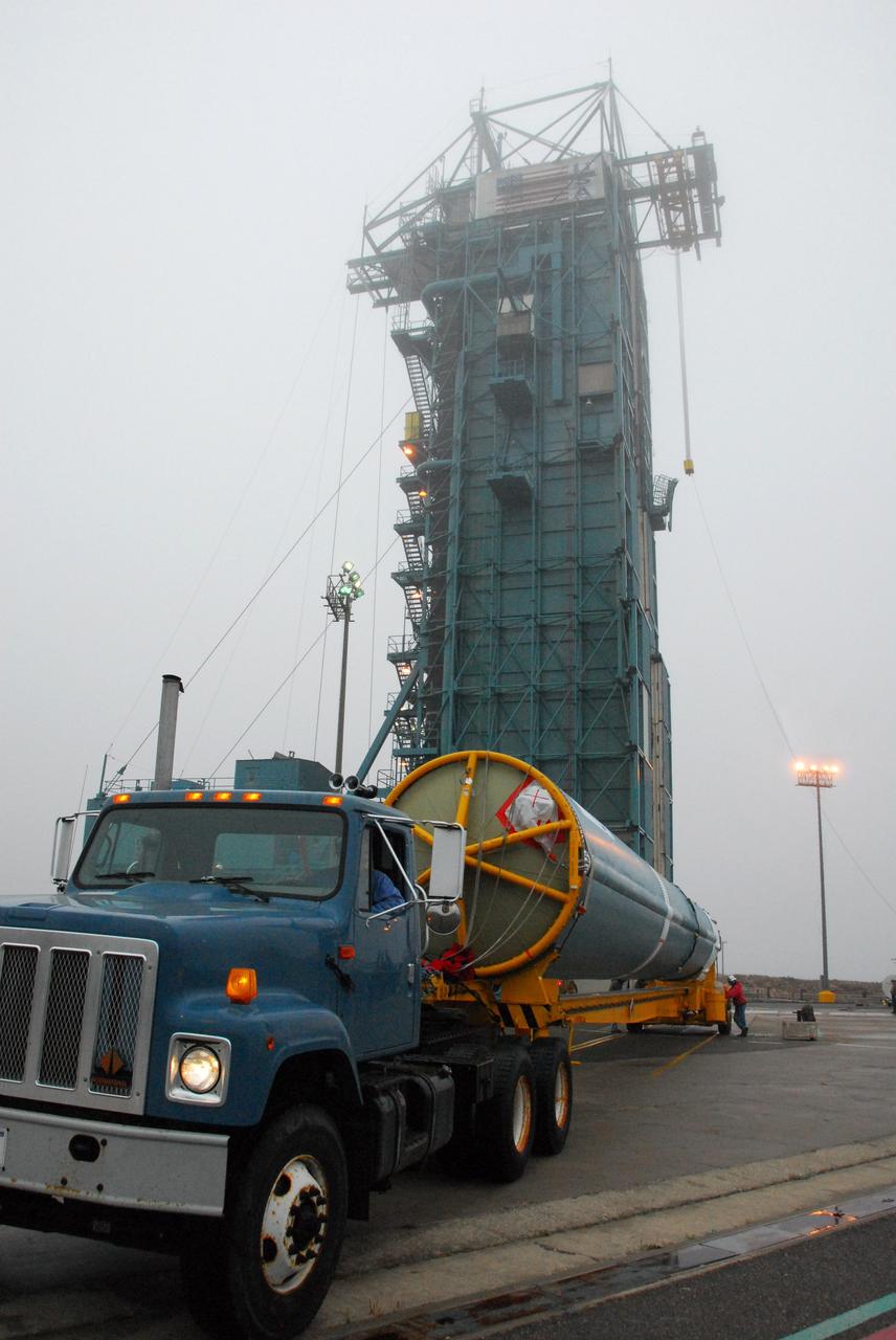 VANDENBERG AIR FORCE BASE, Calif. -- The first stage of a United Launch Alliance Delta II that will carry NASA's National Polar-orbiting Operational Environmental Satellite System Preparatory Project (NPP) satellite into space arrives at NASA's Space Launch Complex-2 on Vandenberg Air Force Base in California.    NPP will be positioned 512 miles above the Earth's surface and will orbit about 16 times each day to observe nearly the entire globe. The NPP mission for NASA and the National Oceanic and Atmospheric Administration (NOAA) is to measure Earth's atmospheric and sea surface temperatures, humidity sounding, land and ocean biological activity, and cloud and aerosol properties. For more information, visit www.nasa.gov/NPP. Photo credit: NASA/VAFB, Mark Mackley