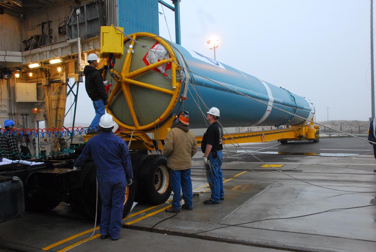 VANDENBERG AIR FORCE BASE, Calif. -- At NASA's Space Launch Complex-2 on Vandenberg Air Force Base in California, workers prepare to lift the first stage of a United Launch Alliance Delta II that will carry NASA's National Polar-orbiting Operational Environmental Satellite System Preparatory Project (NPP) satellite into space.    NPP will be positioned 512 miles above the Earth's surface and will orbit about 16 times each day to observe nearly the entire globe. The NPP mission for NASA and the National Oceanic and Atmospheric Administration (NOAA) is to measure Earth's atmospheric and sea surface temperatures, humidity sounding, land and ocean biological activity, and cloud and aerosol properties. For more information, visit www.nasa.gov/NPP. Photo credit: NASA/VAFB, Mark Mackley