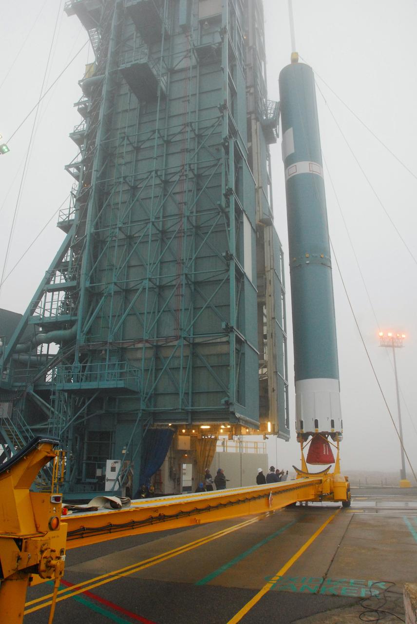 VANDENBERG AIR FORCE BASE, Calif. -- The first stage of a United Launch Alliance Delta II is lifted at NASA's Space Launch Complex-2 on Vandenberg Air Force Base in California. The rocket will carry NASA's National Polar-orbiting Operational Environmental Satellite System Preparatory Project (NPP) satellite into space.    NPP will be positioned 512 miles above the Earth's surface and will orbit about 16 times each day to observe nearly the entire globe. The NPP mission for NASA and the National Oceanic and Atmospheric Administration (NOAA) is to measure Earth's atmospheric and sea surface temperatures, humidity sounding, land and ocean biological activity, and cloud and aerosol properties. For more information, visit www.nasa.gov/NPP. Photo credit: NASA/VAFB, Mark Mackley