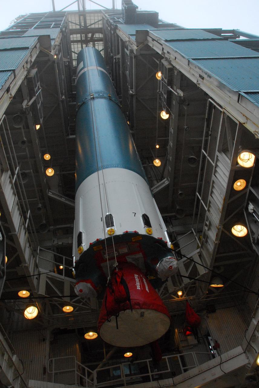 VANDENBERG AIR FORCE BASE, Calif. -- The first stage of a United Launch Alliance Delta II is hoisted into place at NASA's Space Launch Complex-2 on Vandenberg Air Force Base in California. The rocket will carry NASA's National Polar-orbiting Operational Environmental Satellite System Preparatory Project (NPP) satellite into space.    NPP will be positioned 512 miles above the Earth's surface and will orbit about 16 times each day to observe nearly the entire globe. The NPP mission for NASA and the National Oceanic and Atmospheric Administration (NOAA) is to measure Earth's atmospheric and sea surface temperatures, humidity sounding, land and ocean biological activity, and cloud and aerosol properties. For more information, visit www.nasa.gov/NPP. Photo credit: NASA/VAFB, Mark Mackley