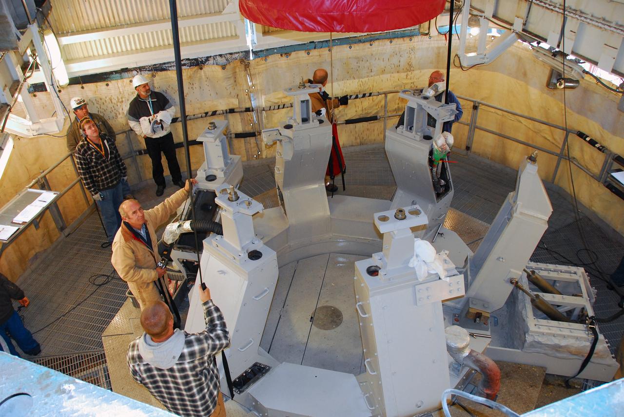 VANDENBERG AIR FORCE BASE, Calif. -- The first stage of a United Launch Alliance Delta II is lowered into place at NASA's Space Launch Complex-2 on Vandenberg Air Force Base in California. Seen here in red is the Rocketdyne engine that will help loft the rocket off the pad. The rocket will carry NASA's National Polar-orbiting Operational Environmental Satellite System Preparatory Project (NPP) satellite into space.    NPP will be positioned 512 miles above the Earth's surface and will orbit about 16 times each day to observe nearly the entire globe. The NPP mission for NASA and the National Oceanic and Atmospheric Administration (NOAA) is to measure Earth's atmospheric and sea surface temperatures, humidity sounding, land and ocean biological activity, and cloud and aerosol properties. For more information, visit www.nasa.gov/NPP. Photo credit: NASA/VAFB, Mark Mackley