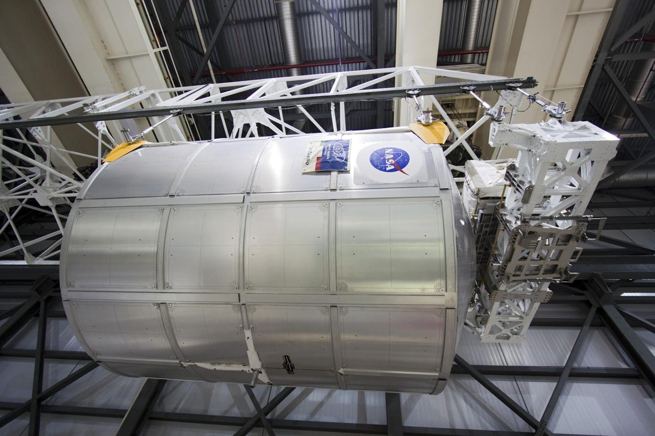 CAPE CANAVERAL, Fla. -- In Orbiter Processing Facility-2 (OPF-2) at NASA’s Kennedy Space Center in Florida, a special payload removal device is used to lift the Raffaello multi-purpose logistics module away from Atlantis’ cargo bay. Raffaello will then be readied for transport to the Space Station Processing Facility where its contents will be unloaded. Atlantis completed NASA’s final space shuttle mission, STS-135, after landing at the center’s Shuttle Landing Facility, July 21, 2011, at 5:57 a.m. EDT. Following removal of all payloads in Atlantis’ cargo bay, workers will begin to prepare the spacecraft for eventual permanent display at the Kennedy Space Center Visitor Complex. Photo credit: Jim Grossman