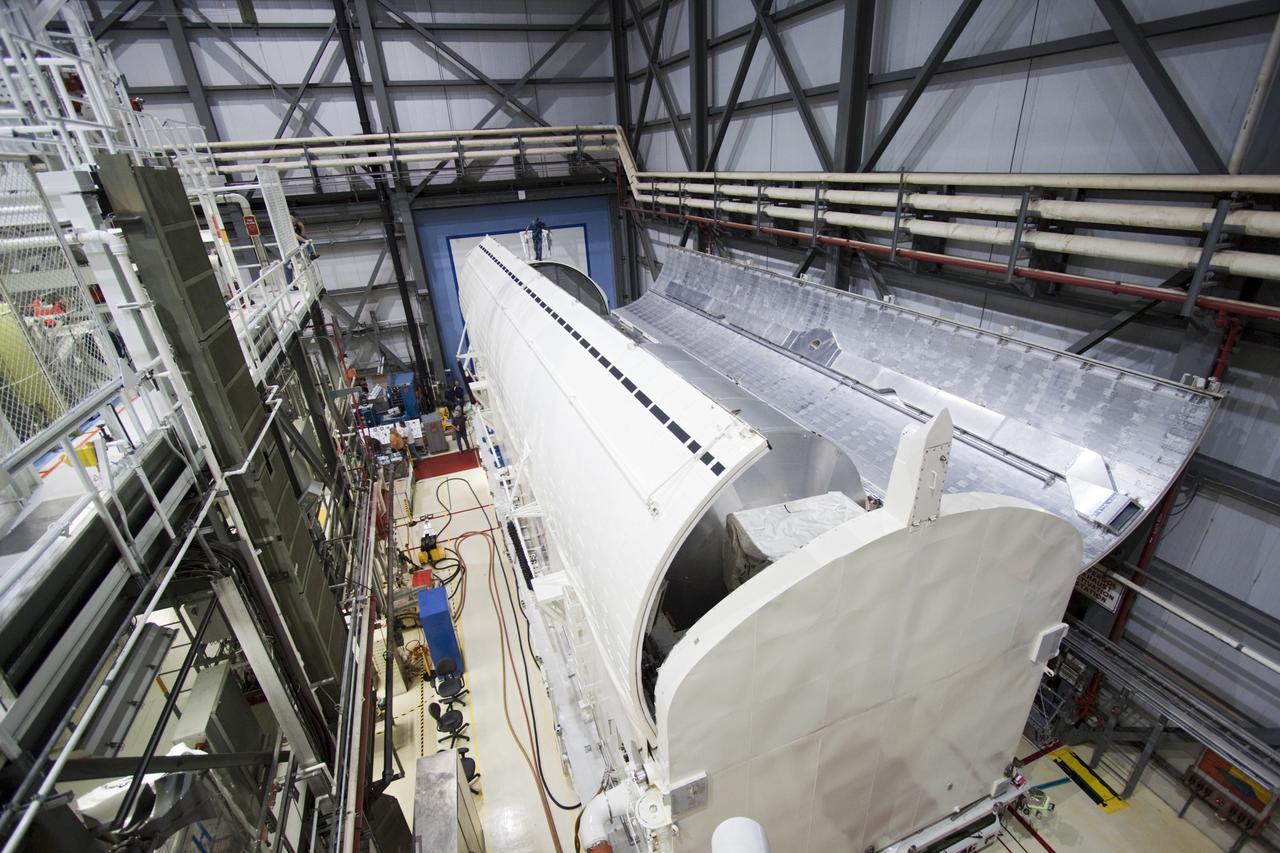 CAPE CANAVERAL, Fla. -- In Orbiter Processing Facility-2 (OPF-2) at NASA’s Kennedy Space Center in Florida, doors begin to close around the Raffaello multi-purpose logistics module after it was secured in the payload canister. A special payload removal device was used to remove it from Atlantis’ cargo bay. Raffaello will then be readied for transport to the Space Station Processing Facility where its contents will be unloaded. Atlantis completed NASA’s final space shuttle mission, STS-135, after landing at the center’s Shuttle Landing Facility, July 21, 2011, at 5:57 a.m. EDT. Following removal of all payloads in Atlantis’ cargo bay, workers will begin to prepare the spacecraft for eventual permanent display at the Kennedy Space Center Visitor Complex. Photo credit: Jim Grossman