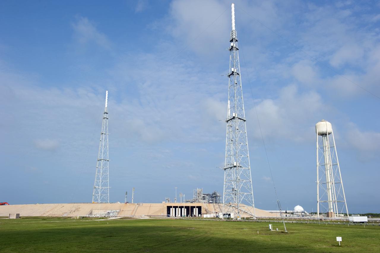 CAPE CANAVERAL, Fla. -- At NASA's Kennedy Space Center in Florida, the water tower (right) which supported the space shuttle's water deluge system still stands on Launch Pad 39B after the pad's deconstruction.    In 2009, the structure at the pad was no longer needed for NASA's Space Shuttle Program, so it is being restructured for future use. The new design will feature a "clean pad" for rockets to come with their own launcher, making it more versatile for a number of vehicles. For information on NASA's future plans, visit http://www.nasa.gov/exploration. Photo credit: NASA/Kim Shiflett