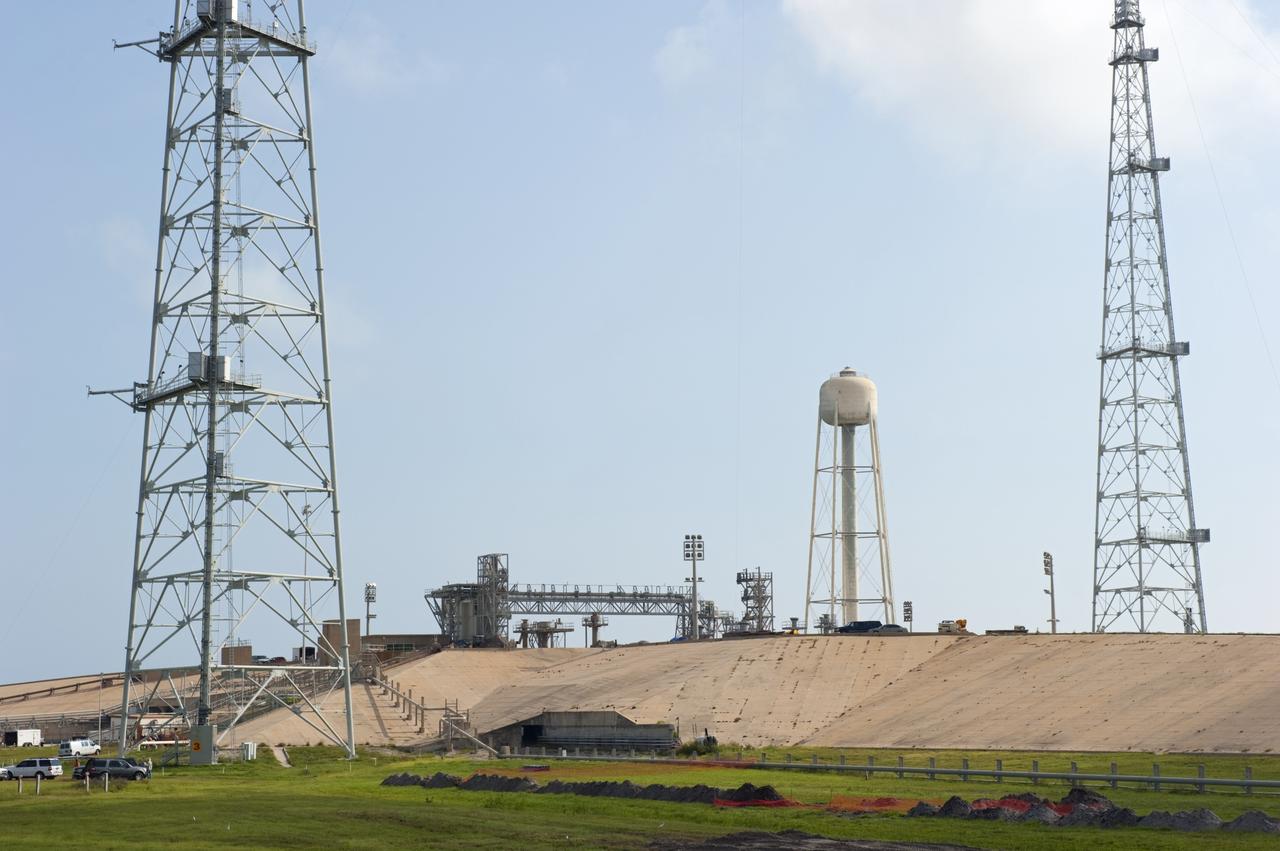 CAPE CANAVERAL, Fla. -- At NASA's Kennedy Space Center in Florida, only remnants of the fixed and rotating service structures remain on Launch Pad 39B after the pad's deconstruction. In 2009, the structure at the pad was no longer needed for NASA's Space Shuttle Program, so it is being restructured for future use. The new design will feature a "clean pad" for rockets to come with their own launcher, making it more versatile for a number of vehicles. For information on NASA's future plans, visit http://www.nasa.gov/exploration. Photo credit: NASA/Kim Shiflett