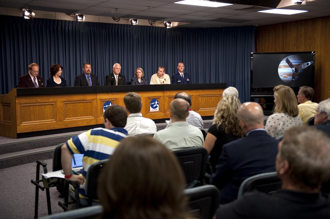 CAPE CANAVERAL, Fla. -- Media representatives question the participants of a Juno prelaunch news conference in the NASA Press Site auditorium at NASA's Kennedy Space Center in Florida.  From left are George Diller, NASA Public Affairs; Colleen Hartman, assistant associate administrator, Science Mission Directorate, NASA Headquarters, Washington; Omar Baez, NASA launch director, Kennedy Space Center, Cape Canaveral, Fla.; Vernon Thorp, program manager, NASA Missions, United Launch Alliance, Denver, Colo.; Jan Chodas, Juno project manager, Jet Propulsion Laboratory, Pasadena, Calif.; Tim Gasparrini, Juno program manager, Lockheed Martin Space Systems, Denver, Colo.; and Capt. Billy Whisel, launch weather officer, 45th Weather Squadron, Cape Canaveral Air Force Station, Fla.    Juno is scheduled to launch Aug. 5 aboard a United Launch Alliance Atlas V rocket from Cape Canaveral Air Force Station in Florida. The solar-powered spacecraft will orbit Jupiter's poles 33 times to find out more about the gas giant's origins, structure, atmosphere and magnetosphere and investigate the existence of a solid planetary core. For more information, visit www.nasa.gov/juno. Photo credit: NASA/Kim Shiflett