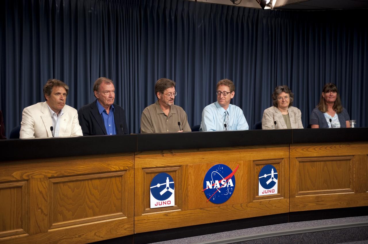 CAPE CANAVERAL, Fla. -- A Juno mission science briefing is held in the NASA Press Site auditorium at NASA's Kennedy Space Center in Florida.  From left are Scott Bolton, Juno principal investigator, Southwest Research Institute, San Antonio; Toby Owen, Juno co-investigator, University of Hawaii; Jack Connerney, Juno MAG Instrument Lead, Goddard Space Flight Center, Greenbelt, Md.; Steve Levin, Juno project scientist, Jet Propulsion Laboratory, Pasadena, Calif.; Fran Bagenai, Juno co-investigator, University of Colorado, Boulder, Colo.; and Candy Hansen, Juno co-investigator, Planetary Science Institute, Tucson, Ariz.    Juno is scheduled to launch Aug. 5 aboard a United Launch Alliance Atlas V rocket from Cape Canaveral Air Force Station in Florida. The solar-powered spacecraft will orbit Jupiter's poles 33 times to find out more about the gas giant's origins, structure, atmosphere and magnetosphere and investigate the existence of a solid planetary core. For more information, visit www.nasa.gov/juno. Photo credit: NASA/Kim Shiflett