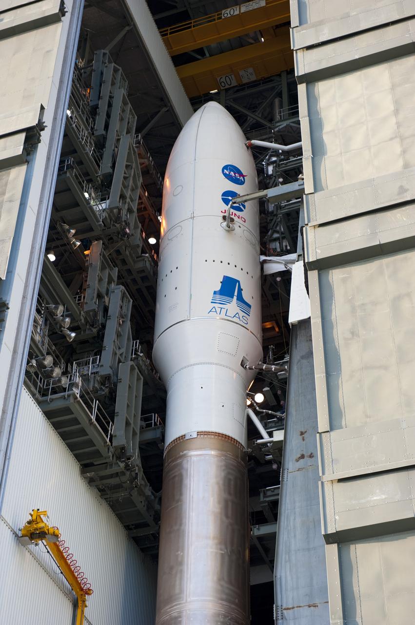 CAPE CANAVERAL, Fla. -- In the Vertical Integration Facility on Cape Canaveral Air Force Station in Florida, NASA's Juno spacecraft, enclosed in its payload fairing, sits atop the United Launch Alliance Atlas V-551 launch vehicle, awaiting its move to Space Launch Complex 41.    Liftoff is planned during a launch window which extends from 11:34 a.m. to 12:43 p.m. EDT on Aug. 5. The solar-powered spacecraft will orbit Jupiter's poles 33 times to find out more about the gas giant's origins, structure, atmosphere and magnetosphere and investigate the existence of a solid planetary core. NASA's Jet Propulsion Laboratory, Pasadena, Calif., manages the Juno mission for the principal investigator, Scott Bolton, of Southwest Research Institute in San Antonio. The Juno mission is part of the New Frontiers Program managed at NASA's Marshall Space Flight Center in Huntsville, Ala. Lockheed Martin Space Systems, Denver, built the spacecraft. Launch management for the mission is the responsibility of NASA's Launch Services Program at the Kennedy Space Center in Florida.  For more information, visit www.nasa.gov/juno. Photo credit: NASA/Kim Shiflett