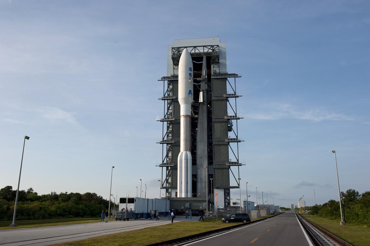 CAPE CANAVERAL, Fla. -- On Cape Canaveral Air Force Station in Florida, the 197-foot-tall United Launch Alliance Atlas V-551 launch vehicle stands outside the Vertical Integration Facility as it rolls to Space Launch Complex 41.  Atop the rocket is NASA's Juno spacecraft, enclosed in its payload fairing.    Liftoff is planned during a launch window which extends from 11:34 a.m. to 12:43 p.m. EDT on Aug. 5. The solar-powered spacecraft will orbit Jupiter's poles 33 times to find out more about the gas giant's origins, structure, atmosphere and magnetosphere and investigate the existence of a solid planetary core. NASA's Jet Propulsion Laboratory, Pasadena, Calif., manages the Juno mission for the principal investigator, Scott Bolton, of Southwest Research Institute in San Antonio. The Juno mission is part of the New Frontiers Program managed at NASA's Marshall Space Flight Center in Huntsville, Ala. Lockheed Martin Space Systems, Denver, built the spacecraft. Launch management for the mission is the responsibility of NASA's Launch Services Program at the Kennedy Space Center in Florida.  For more information, visit www.nasa.gov/juno. Photo credit: NASA/Kim Shiflett