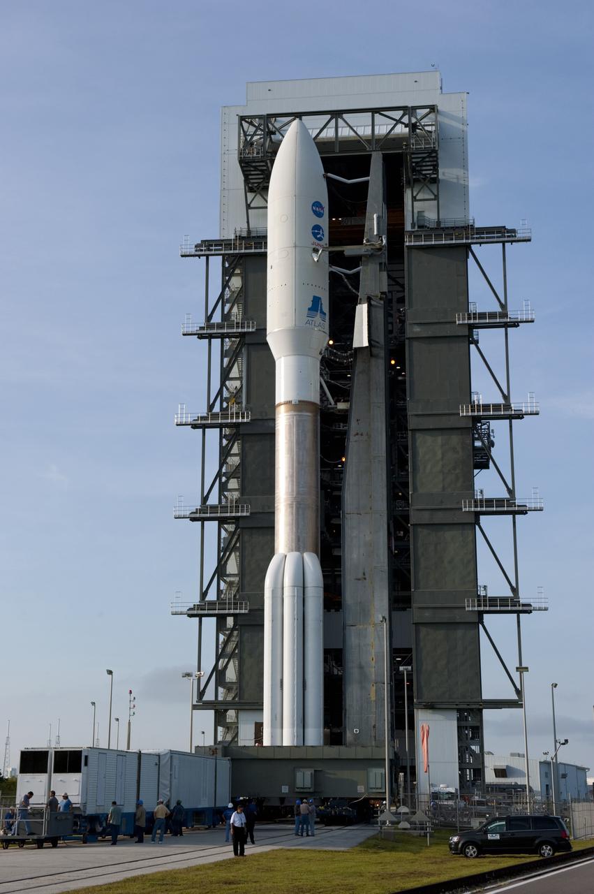 CAPE CANAVERAL, Fla. -- On Cape Canaveral Air Force Station in Florida, the 197-foot-tall United Launch Alliance Atlas V-551 launch vehicle basks in the sunshine outside the Vertical Integration Facility during its move to Space Launch Complex 41.  Atop the rocket is NASA's Juno spacecraft, enclosed in its payload fairing.    Liftoff is planned during a launch window which extends from 11:34 a.m. to 12:43 p.m. EDT on Aug. 5. The solar-powered spacecraft will orbit Jupiter's poles 33 times to find out more about the gas giant's origins, structure, atmosphere and magnetosphere and investigate the existence of a solid planetary core. NASA's Jet Propulsion Laboratory, Pasadena, Calif., manages the Juno mission for the principal investigator, Scott Bolton, of Southwest Research Institute in San Antonio. The Juno mission is part of the New Frontiers Program managed at NASA's Marshall Space Flight Center in Huntsville, Ala. Lockheed Martin Space Systems, Denver, built the spacecraft. Launch management for the mission is the responsibility of NASA's Launch Services Program at the Kennedy Space Center in Florida.  For more information, visit www.nasa.gov/juno. Photo credit: NASA/Kim Shiflett