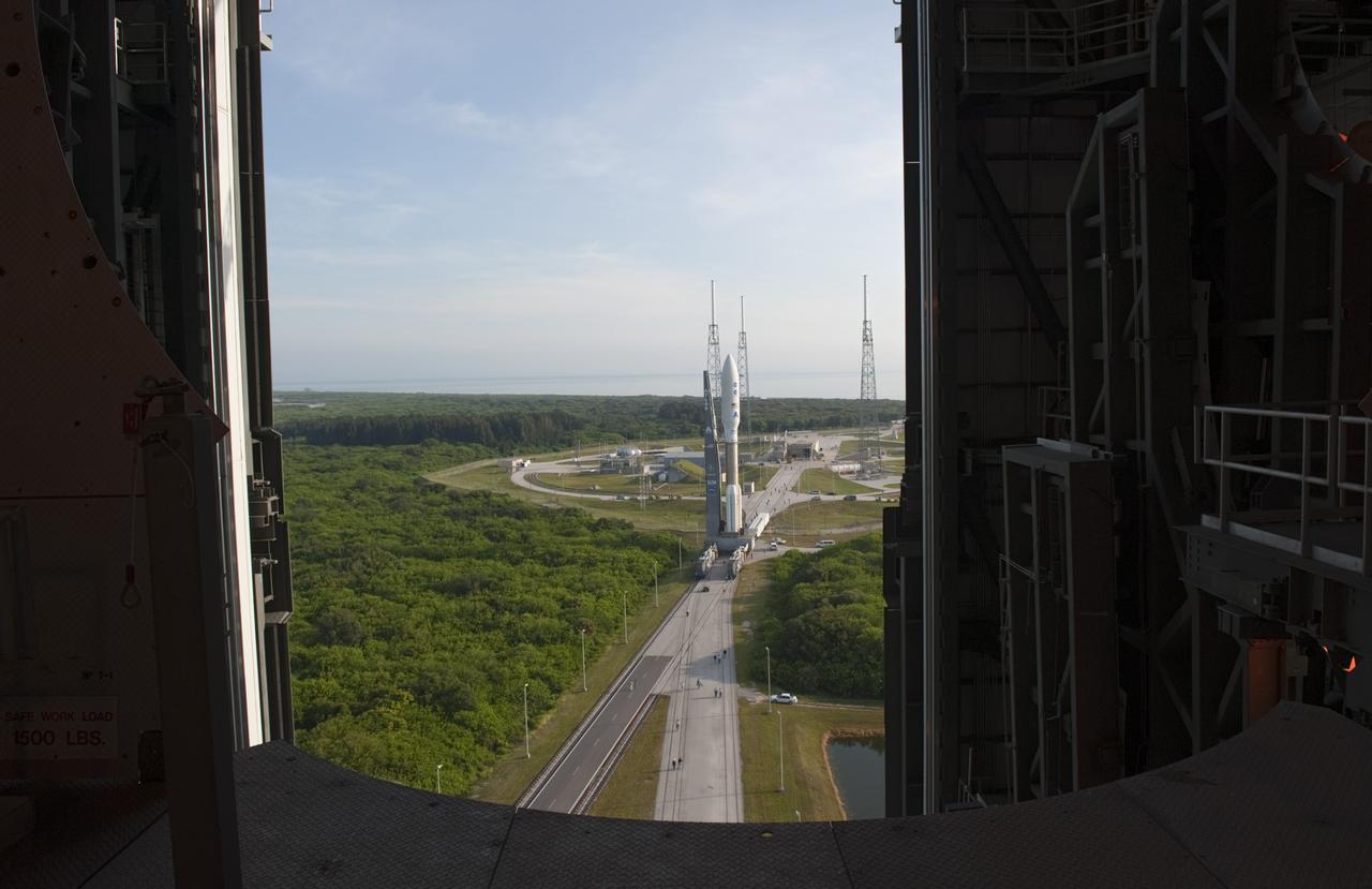 CAPE CANAVERAL, Fla. -- On Cape Canaveral Air Force Station in Florida, the Vertical Integration Facility offers a unique vantage point to view the United Launch Alliance Atlas V-551 launch vehicle as it makes a slow, steady approach to Space Launch Complex 41.  Atop the rocket is NASA's Juno spacecraft, enclosed in its payload fairing.    Liftoff is planned during a launch window which extends from 11:34 a.m. to 12:43 p.m. EDT on Aug. 5. The solar-powered spacecraft will orbit Jupiter's poles 33 times to find out more about the gas giant's origins, structure, atmosphere and magnetosphere and investigate the existence of a solid planetary core. NASA's Jet Propulsion Laboratory, Pasadena, Calif., manages the Juno mission for the principal investigator, Scott Bolton, of Southwest Research Institute in San Antonio. The Juno mission is part of the New Frontiers Program managed at NASA's Marshall Space Flight Center in Huntsville, Ala. Lockheed Martin Space Systems, Denver, built the spacecraft. Launch management for the mission is the responsibility of NASA's Launch Services Program at the Kennedy Space Center in Florida.  For more information, visit www.nasa.gov/juno. Photo credit: NASA/Kim Shiflett