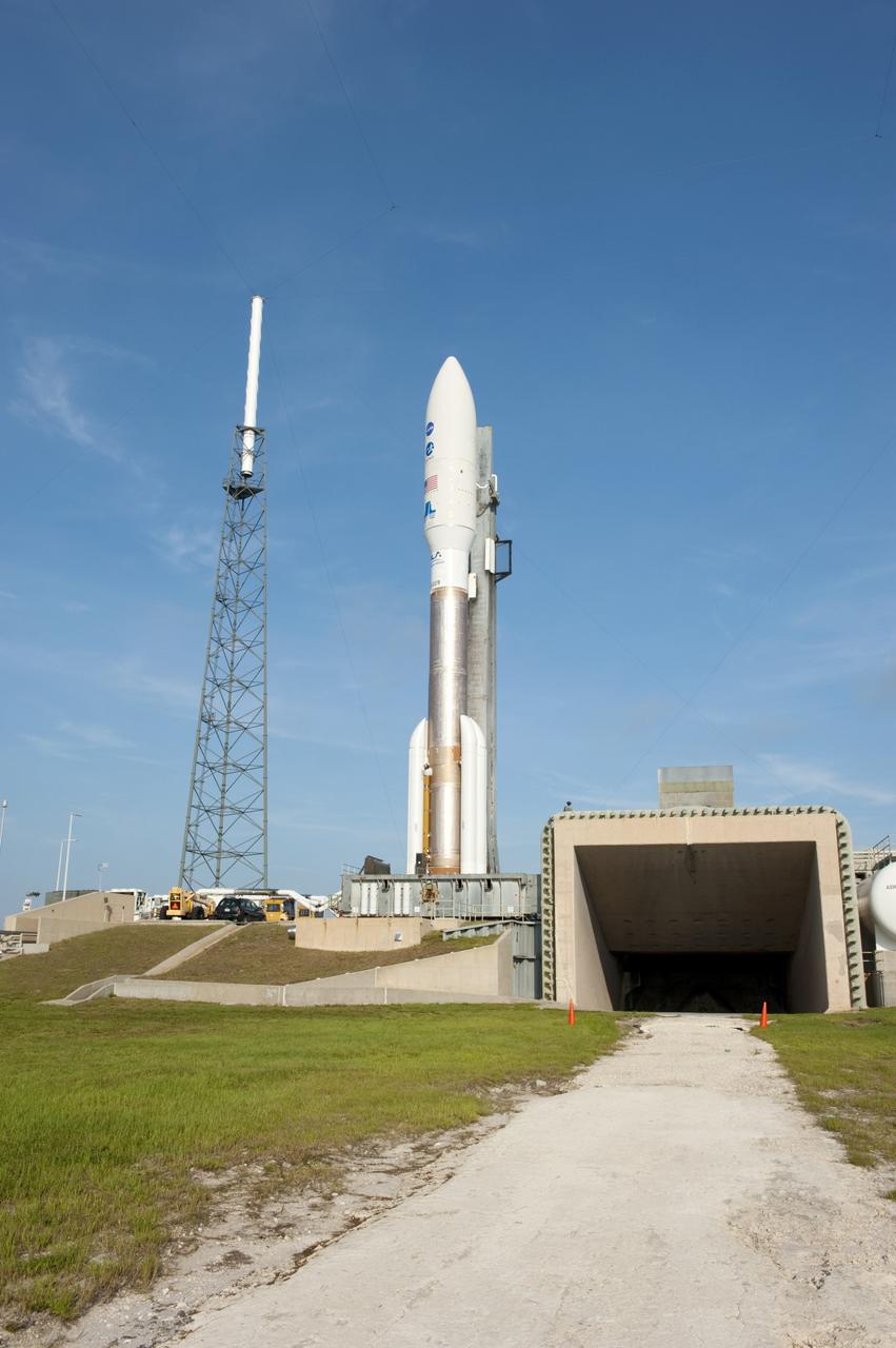 CAPE CANAVERAL, Fla. -- On Cape Canaveral Air Force Station in Florida, the 197-foot-tall United Launch Alliance Atlas V-551 launch vehicle is in position beside the exhaust duct on the launch pad at Space Launch Complex 41.  Atop the rocket is NASA's Juno spacecraft, enclosed in its payload fairing.    Liftoff is planned during a launch window which extends from 11:34 a.m. to 12:43 p.m. EDT on Aug. 5. The solar-powered spacecraft will orbit Jupiter's poles 33 times to find out more about the gas giant's origins, structure, atmosphere and magnetosphere and investigate the existence of a solid planetary core. NASA's Jet Propulsion Laboratory, Pasadena, Calif., manages the Juno mission for the principal investigator, Scott Bolton, of Southwest Research Institute in San Antonio. The Juno mission is part of the New Frontiers Program managed at NASA's Marshall Space Flight Center in Huntsville, Ala. Lockheed Martin Space Systems, Denver, built the spacecraft. Launch management for the mission is the responsibility of NASA's Launch Services Program at the Kennedy Space Center in Florida.  For more information, visit www.nasa.gov/juno. Photo credit: NASA/Kim Shiflett