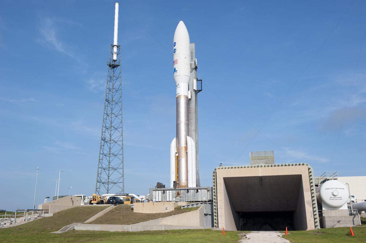 CAPE CANAVERAL, Fla. -- On Cape Canaveral Air Force Station in Florida, the 197-foot-tall United Launch Alliance Atlas V-551 launch vehicle is in position beside the exhaust duct on the launch pad at Space Launch Complex 41.  Atop the rocket is NASA's Juno spacecraft, enclosed in its payload fairing.    Liftoff is planned during a launch window which extends from 11:34 a.m. to 12:43 p.m. EDT on Aug. 5. The solar-powered spacecraft will orbit Jupiter's poles 33 times to find out more about the gas giant's origins, structure, atmosphere and magnetosphere and investigate the existence of a solid planetary core. NASA's Jet Propulsion Laboratory, Pasadena, Calif., manages the Juno mission for the principal investigator, Scott Bolton, of Southwest Research Institute in San Antonio. The Juno mission is part of the New Frontiers Program managed at NASA's Marshall Space Flight Center in Huntsville, Ala. Lockheed Martin Space Systems, Denver, built the spacecraft. Launch management for the mission is the responsibility of NASA's Launch Services Program at the Kennedy Space Center in Florida.  For more information, visit www.nasa.gov/juno. Photo credit: NASA/Kim Shiflett