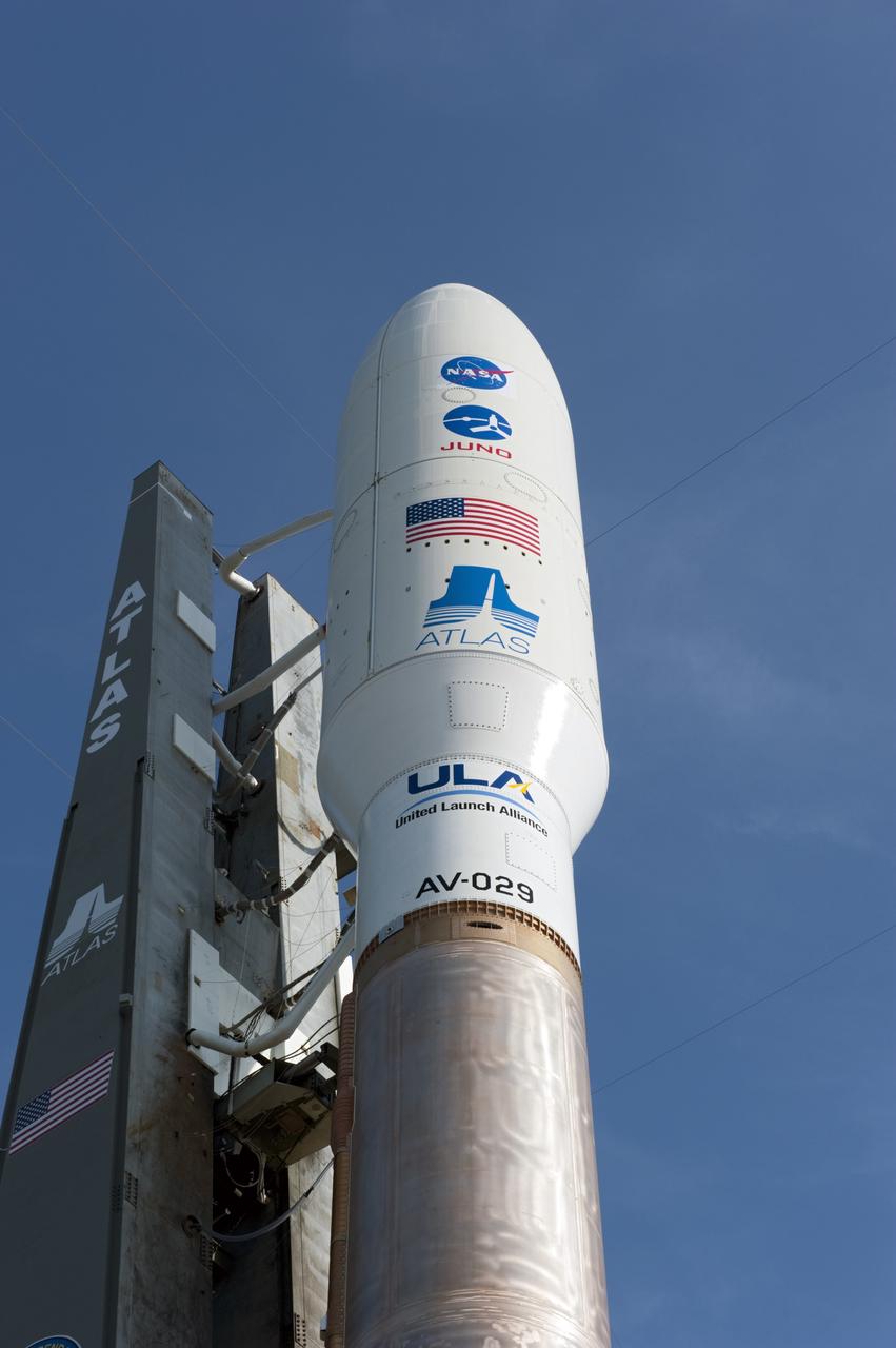 CAPE CANAVERAL, Fla. -- NASA's Juno spacecraft, enclosed in its payload fairing, is poised for launch above the United Launch Alliance Atlas V-551 launch vehicle at Space Launch Complex 41 on Cape Canaveral Air Force Station in Florida.      Liftoff is planned during a launch window which extends from 11:34 a.m. to 12:43 p.m. EDT on Aug. 5. The solar-powered spacecraft will orbit Jupiter's poles 33 times to find out more about the gas giant's origins, structure, atmosphere and magnetosphere and investigate the existence of a solid planetary core. NASA's Jet Propulsion Laboratory, Pasadena, Calif., manages the Juno mission for the principal investigator, Scott Bolton, of Southwest Research Institute in San Antonio. The Juno mission is part of the New Frontiers Program managed at NASA's Marshall Space Flight Center in Huntsville, Ala. Lockheed Martin Space Systems, Denver, built the spacecraft. Launch management for the mission is the responsibility of NASA's Launch Services Program at the Kennedy Space Center in Florida.  For more information, visit www.nasa.gov/juno. Photo credit: NASA/Kim Shiflett