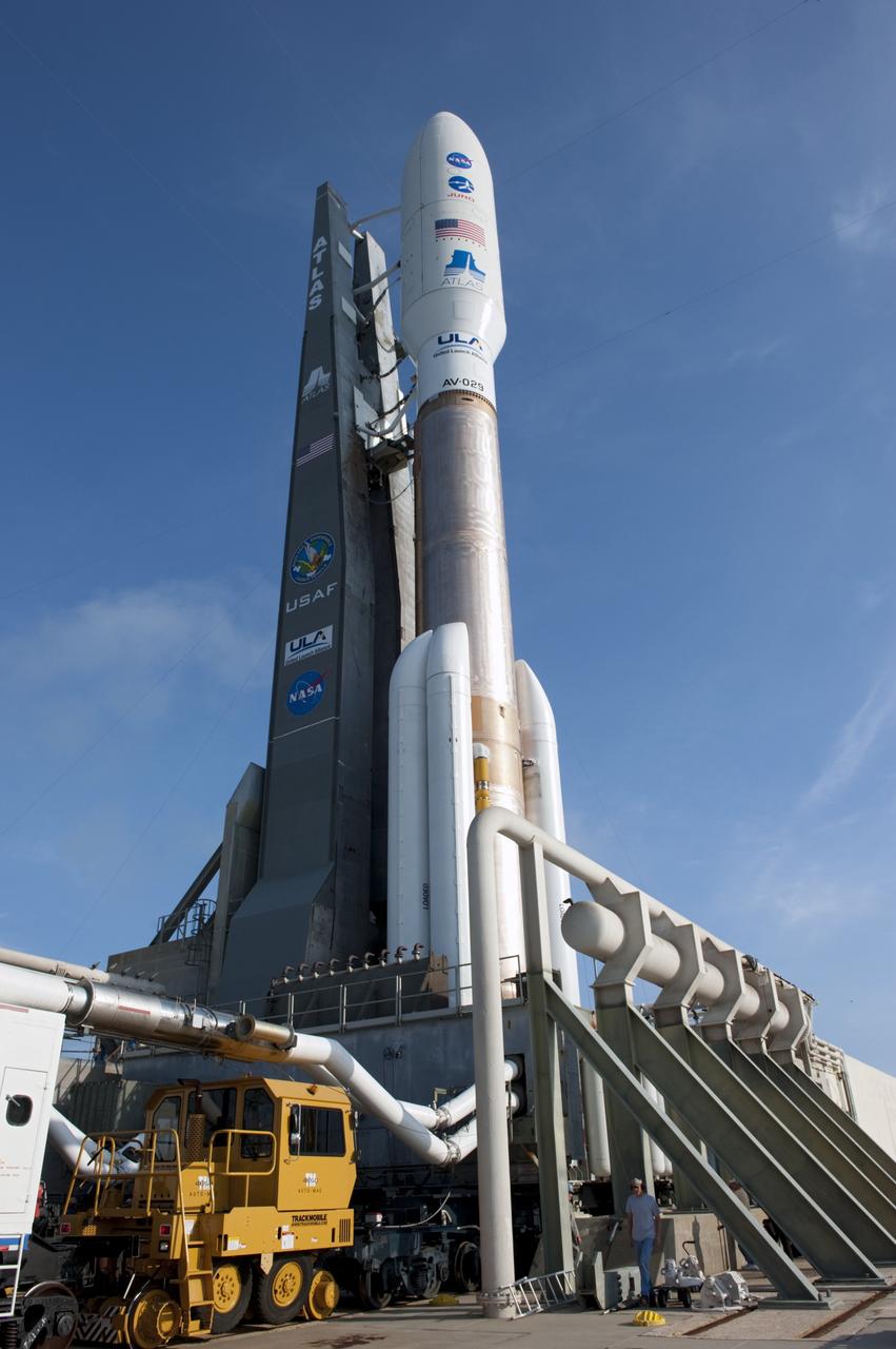 CAPE CANAVERAL, Fla. -- A United Launch Alliance worker does his part to prepare the newly arrived 197-foot-tall Atlas V-551 launch vehicle for liftoff from Space Launch Complex 41 on Cape Canaveral Air Force Station in Florida.  Atop the rocket is NASA's Juno spacecraft, enclosed in its payload fairing.     Liftoff is planned during a launch window which extends from 11:34 a.m. to 12:43 p.m. EDT on Aug. 5. The solar-powered spacecraft will orbit Jupiter's poles 33 times to find out more about the gas giant's origins, structure, atmosphere and magnetosphere and investigate the existence of a solid planetary core. NASA's Jet Propulsion Laboratory, Pasadena, Calif., manages the Juno mission for the principal investigator, Scott Bolton, of Southwest Research Institute in San Antonio. The Juno mission is part of the New Frontiers Program managed at NASA's Marshall Space Flight Center in Huntsville, Ala. Lockheed Martin Space Systems, Denver, built the spacecraft. Launch management for the mission is the responsibility of NASA's Launch Services Program at the Kennedy Space Center in Florida.  For more information, visit www.nasa.gov/juno. Photo credit: NASA/Kim Shiflett