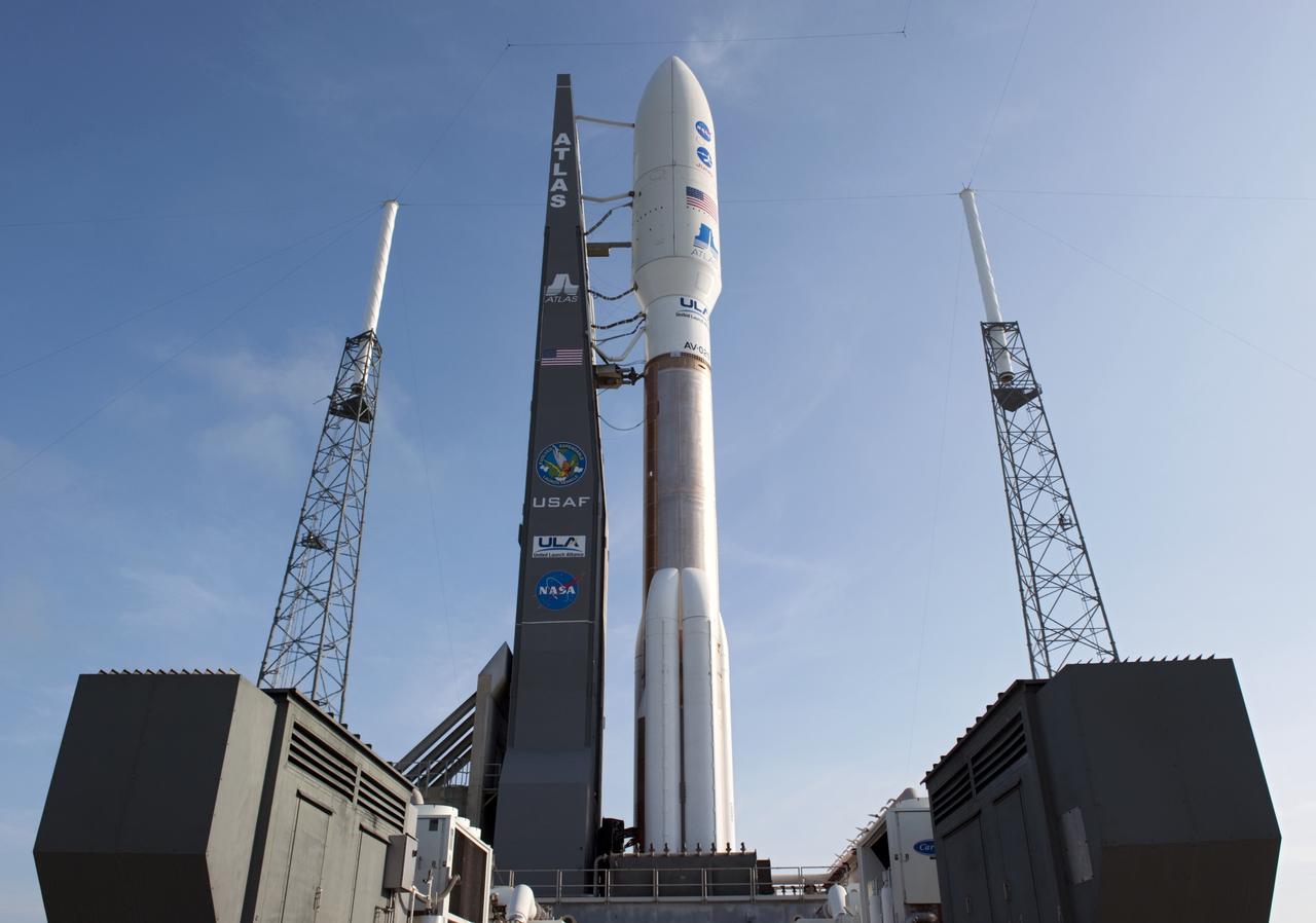 CAPE CANAVERAL, Fla. -- NASA's Juno spacecraft, enclosed in its payload fairing atop a United Launch Alliance Atlas V-551 launch vehicle, towers over Space Launch Complex 41 on Cape Canaveral Air Force Station in Florida.    Launch is planned during a launch window which extends from 11:34 a.m. to 12:43 p.m. EDT on Aug. 5. The solar-powered spacecraft will orbit Jupiter's poles 33 times to find out more about the gas giant's origins, structure, atmosphere and magnetosphere and investigate the existence of a solid planetary core. NASA's Jet Propulsion Laboratory, Pasadena, Calif., manages the Juno mission for the principal investigator, Scott Bolton, of Southwest Research Institute in San Antonio. The Juno mission is part of the New Frontiers Program managed at NASA's Marshall Space Flight Center in Huntsville, Ala. Lockheed Martin Space Systems, Denver, built the spacecraft. Launch management for the mission is the responsibility of NASA's Launch Services Program at the Kennedy Space Center in Florida.  For more information, visit www.nasa.gov/juno. Photo credit: NASA/Kim Shiflett