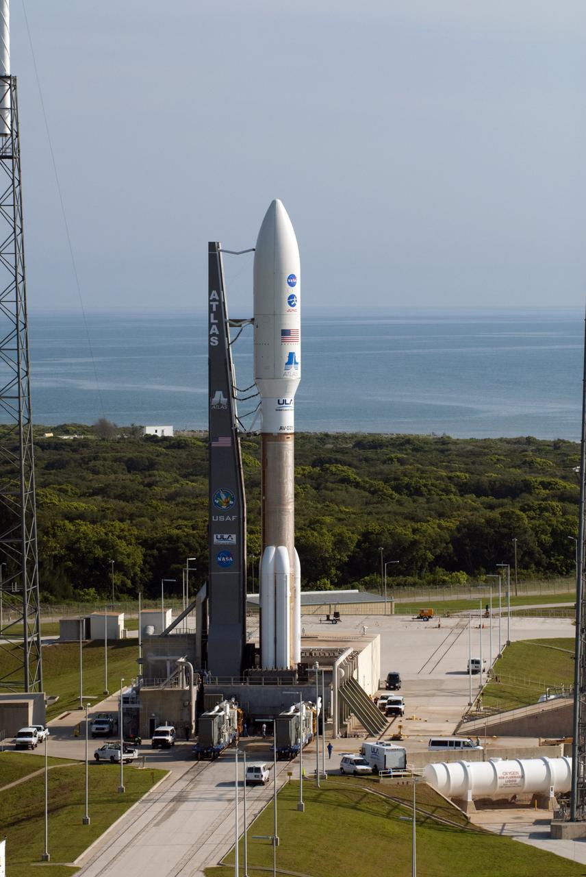CAPE CANAVERAL, Fla. -- NASA's Juno spacecraft, enclosed in its payload fairing atop a United Launch Alliance Atlas V-551 launch vehicle, is perched on its launch pad at Space Launch Complex 41 beside the Atlantic coastline on Cape Canaveral Air Force Station in Florida.     Launch is planned during a launch window which extends from 11:34 a.m. to 12:43 p.m. EDT on Aug. 5. The solar-powered spacecraft will orbit Jupiter's poles 33 times to find out more about the gas giant's origins, structure, atmosphere and magnetosphere and investigate the existence of a solid planetary core. NASA's Jet Propulsion Laboratory, Pasadena, Calif., manages the Juno mission for the principal investigator, Scott Bolton, of Southwest Research Institute in San Antonio. The Juno mission is part of the New Frontiers Program managed at NASA's Marshall Space Flight Center in Huntsville, Ala. Lockheed Martin Space Systems, Denver, built the spacecraft. Launch management for the mission is the responsibility of NASA's Launch Services Program at the Kennedy Space Center in Florida.  For more information, visit www.nasa.gov/juno. Photo credit: NASA/Kim Shiflett