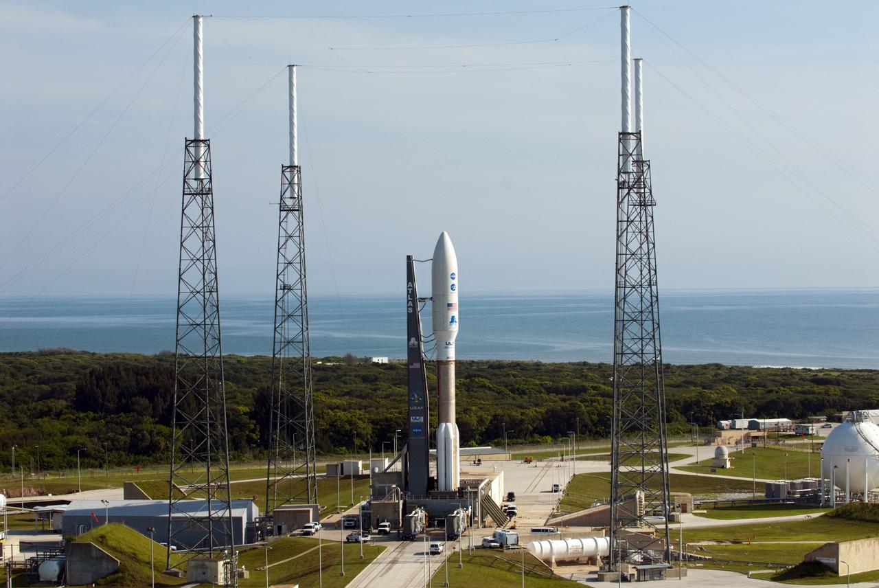 CAPE CANAVERAL, Fla. -- NASA's Juno spacecraft, enclosed in the payload fairing atop a United Launch Alliance Atlas V-551 launch vehicle, arrives at Space Launch Complex 41 on Cape Canaveral Air Force Station in Florida.    Launch is planned during a launch window which extends from 11:34 a.m. to 12:43 p.m. EDT on Aug. 5. The solar-powered spacecraft will orbit Jupiter's poles 33 times to find out more about the gas giant's origins, structure, atmosphere and magnetosphere and investigate the existence of a solid planetary core. NASA's Jet Propulsion Laboratory, Pasadena, Calif., manages the Juno mission for the principal investigator, Scott Bolton, of Southwest Research Institute in San Antonio. The Juno mission is part of the New Frontiers Program managed at NASA's Marshall Space Flight Center in Huntsville, Ala. Lockheed Martin Space Systems, Denver, built the spacecraft. Launch management for the mission is the responsibility of NASA's Launch Services Program at the Kennedy Space Center in Florida.  For more information, visit www.nasa.gov/juno. Photo credit: NASA/Kim Shiflett