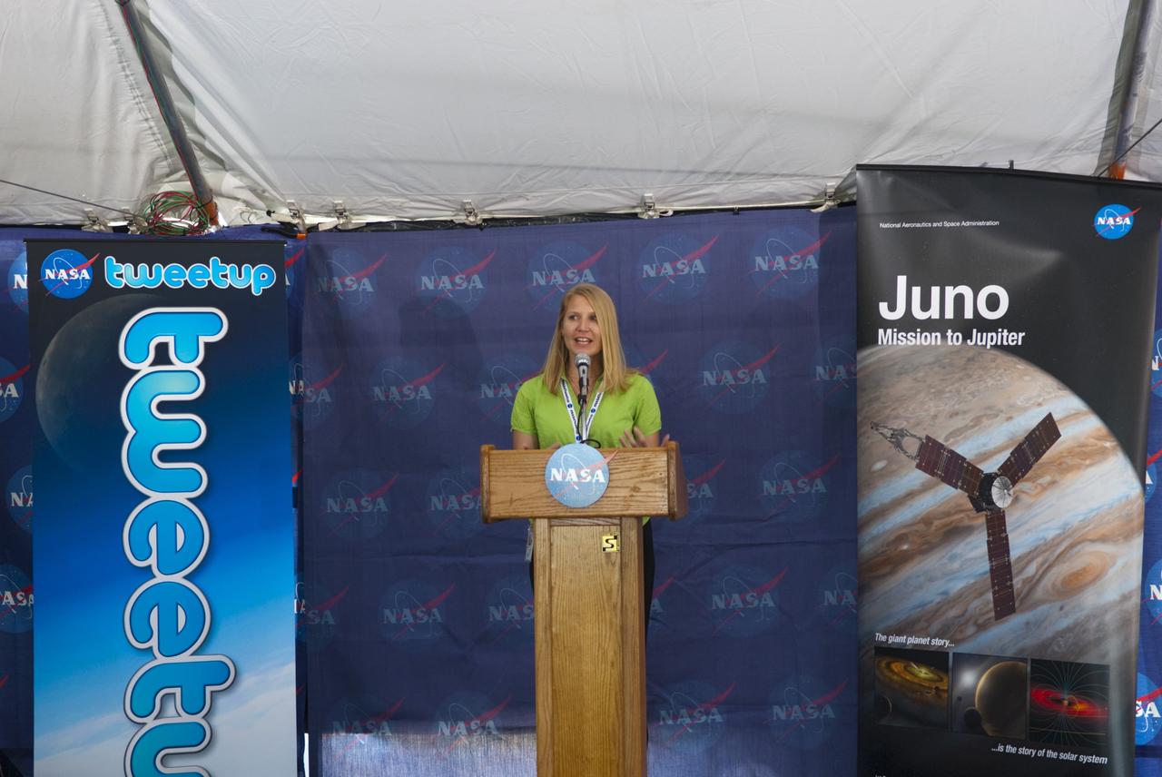 CAPE CANAVERAL, Fla. – At NASA’s Kennedy Space Center in Florida, NASA Tweetup coordinator Stephanie Schierholz welcomes about 150 tweeters to Juno Tweetup activities inside a tent at the Press Site. The tweeters are at the center for two days of prelaunch activities. Juno is NASA’s mission to Jupiter to study the giant planet and improve our understanding of the planet’s formation and evolution. The tweeters will share their experiences with followers through the social networking site Twitter.     Attendees represent 28 states, the District of Columbia and five other countries: Canada, Finland, Norway, Spain and the United Kingdom. This is the first time NASA has invited Twitter followers to experience the launch of a planetary spacecraft.  The Juno spacecraft is scheduled to launch on an Atlas V rocket from Space Launch Complex 41 at Cape Canaveral Air Force Station in Florida, Aug. 5, at 11:34 a.m. EDT.  For more information, visit http://www.nasa.gov/juno.  Photo credit: Jim Grossmann