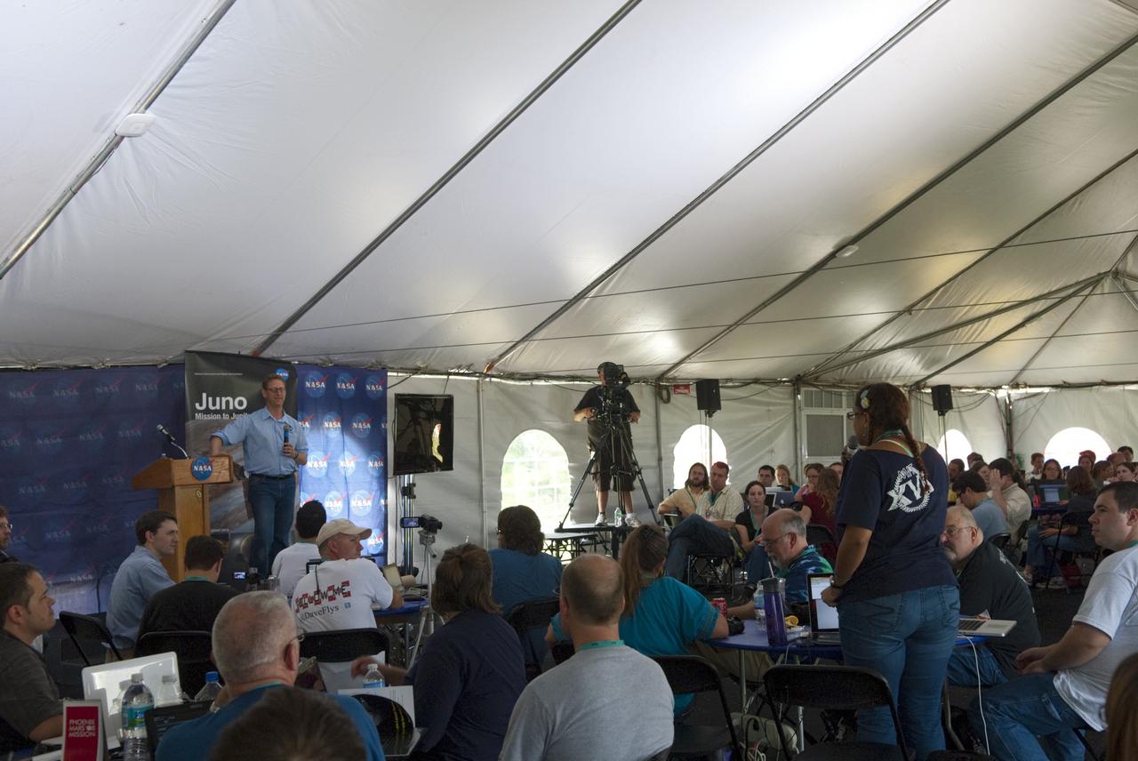 CAPE CANAVERAL, Fla. – At NASA’s Kennedy Space Center in Florida, Steve Levin, Juno project scientist from the Jet Propulsion Laboratory in Pasadena, Calif., speaks to about 150 followers of the agency’s Twitter account during Juno Tweetup activities inside a tent at the Press Site. The tweeters are at the center for two days of prelaunch activities. Juno is NASA’s mission to Jupiter to study the giant planet and improve our understanding of the planet’s formation and evolution. The tweeters will share their experiences with followers through the social networking site Twitter.      Attendees represent 28 states, the District of Columbia and five other countries: Canada, Finland, Norway, Spain and the United Kingdom. This is the first time NASA has invited Twitter followers to experience the launch of a planetary spacecraft.  The Juno spacecraft is scheduled to launch on an Atlas V rocket from Space Launch Complex 41 at Cape Canaveral Air Force Station in Florida, Aug. 5, at 11:34 a.m. EDT.  For more information, visit http://www.nasa.gov/juno.  Photo credit: Jim Grossmann
