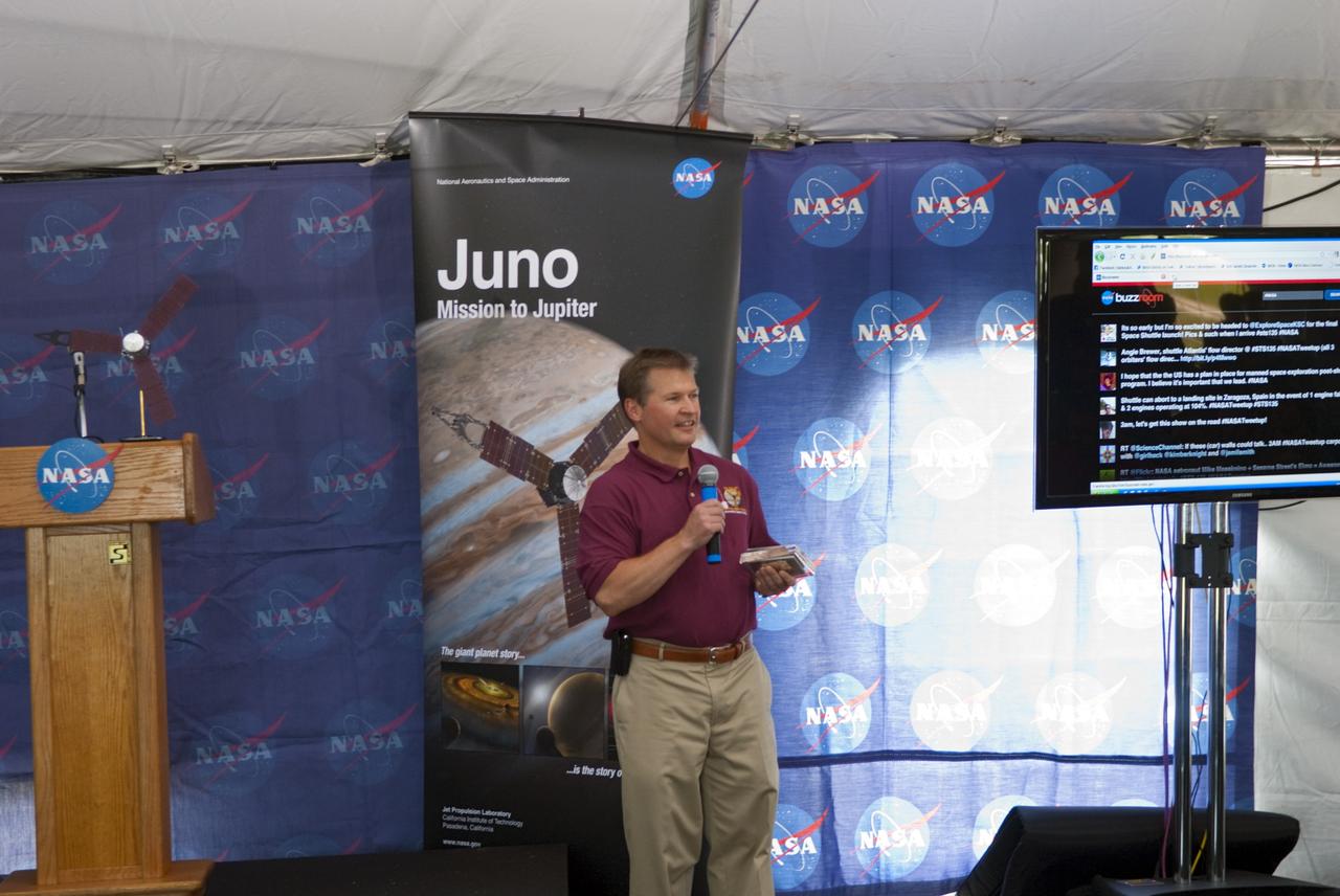 CAPE CANAVERAL, Fla. – At NASA’s Kennedy Space Center in Florida, Chris Brosious, Juno chief systems engineer for Lockheed Martin, speaks to about 150 followers of the agency’s Twitter account during Juno Tweetup activities inside a tent at the Press Site. The tweeters are at the center for two days of prelaunch activities. Juno is NASA’s mission to Jupiter to study the giant planet and improve our understanding of the planet’s formation and evolution. The tweeters will share their experiences with followers through the social networking site Twitter.    Attendees represent 28 states, the District of Columbia and five other countries: Canada, Finland, Norway, Spain and the United Kingdom. This is the first time NASA has invited Twitter followers to experience the launch of a planetary spacecraft.  The Juno spacecraft is scheduled to launch on an Atlas V rocket from Space Launch Complex 41 at Cape Canaveral Air Force Station in Florida, Aug. 5, at 11:34 a.m. EDT.  For more information, visit http://www.nasa.gov/juno.  Photo credit: Jim Grossmann