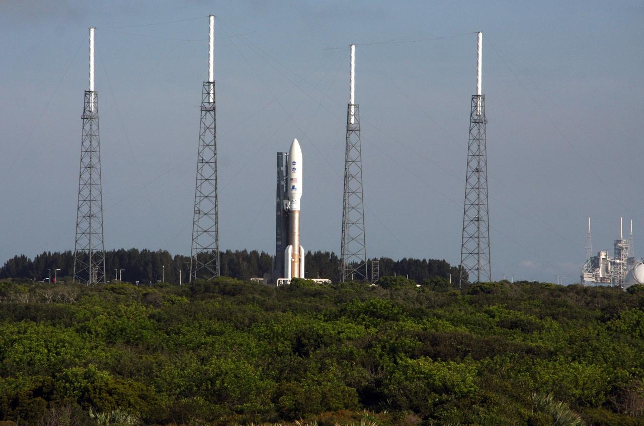 CAPE CANAVERAL, Fla. -- On Cape Canaveral Air Force Station in Florida, the 197-foot-tall United Launch Alliance Atlas V-551 launch vehicle carrying NASA's Juno spacecraft has arrived on the launch pad at Space Launch Complex 41. On Kennedy Space Center property, at right, is Launch Pad 39A, which supported the last space shuttle launch in July.    Liftoff is planned during a launch window which extends from 11:34 a.m. to 12:43 p.m. EDT on Aug. 5. The solar-powered spacecraft will orbit Jupiter's poles 33 times to find out more about the gas giant's origins, structure, atmosphere and magnetosphere and investigate the existence of a solid planetary core. NASA's Jet Propulsion Laboratory, Pasadena, Calif., manages the Juno mission for the principal investigator, Scott Bolton, of Southwest Research Institute in San Antonio. The Juno mission is part of the New Frontiers Program managed at NASA's Marshall Space Flight Center in Huntsville, Ala. Lockheed Martin Space Systems, Denver, built the spacecraft. Launch management for the mission is the responsibility of NASA's Launch Services Program at the Kennedy Space Center in Florida.  For more information, visit www.nasa.gov/juno. Photo credit: NASA/Ken Thornsley