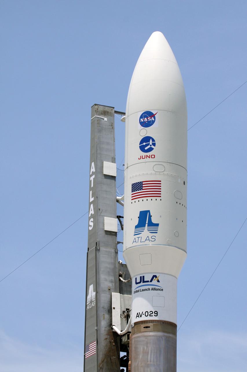 CAPE CANAVERAL, Fla. -- NASA's Juno spacecraft, enclosed in its payload fairing atop a United Launch Alliance Atlas V-551 launch vehicle, stands on the launch pad at Space Launch Complex 41 on Cape Canaveral Air Force Station in Florida ready for launch.     Liftoff is planned during a launch window which extends from 11:34 a.m. to 12:43 p.m. EDT on Aug. 5. The solar-powered spacecraft will orbit Jupiter's poles 33 times to find out more about the gas giant's origins, structure, atmosphere and magnetosphere and investigate the existence of a solid planetary core. NASA's Jet Propulsion Laboratory, Pasadena, Calif., manages the Juno mission for the principal investigator, Scott Bolton, of Southwest Research Institute in San Antonio. The Juno mission is part of the New Frontiers Program managed at NASA's Marshall Space Flight Center in Huntsville, Ala. Lockheed Martin Space Systems, Denver, built the spacecraft. Launch management for the mission is the responsibility of NASA's Launch Services Program at the Kennedy Space Center in Florida.  For more information, visit www.nasa.gov/juno. Photo credit: NASA/Ken Thornsley